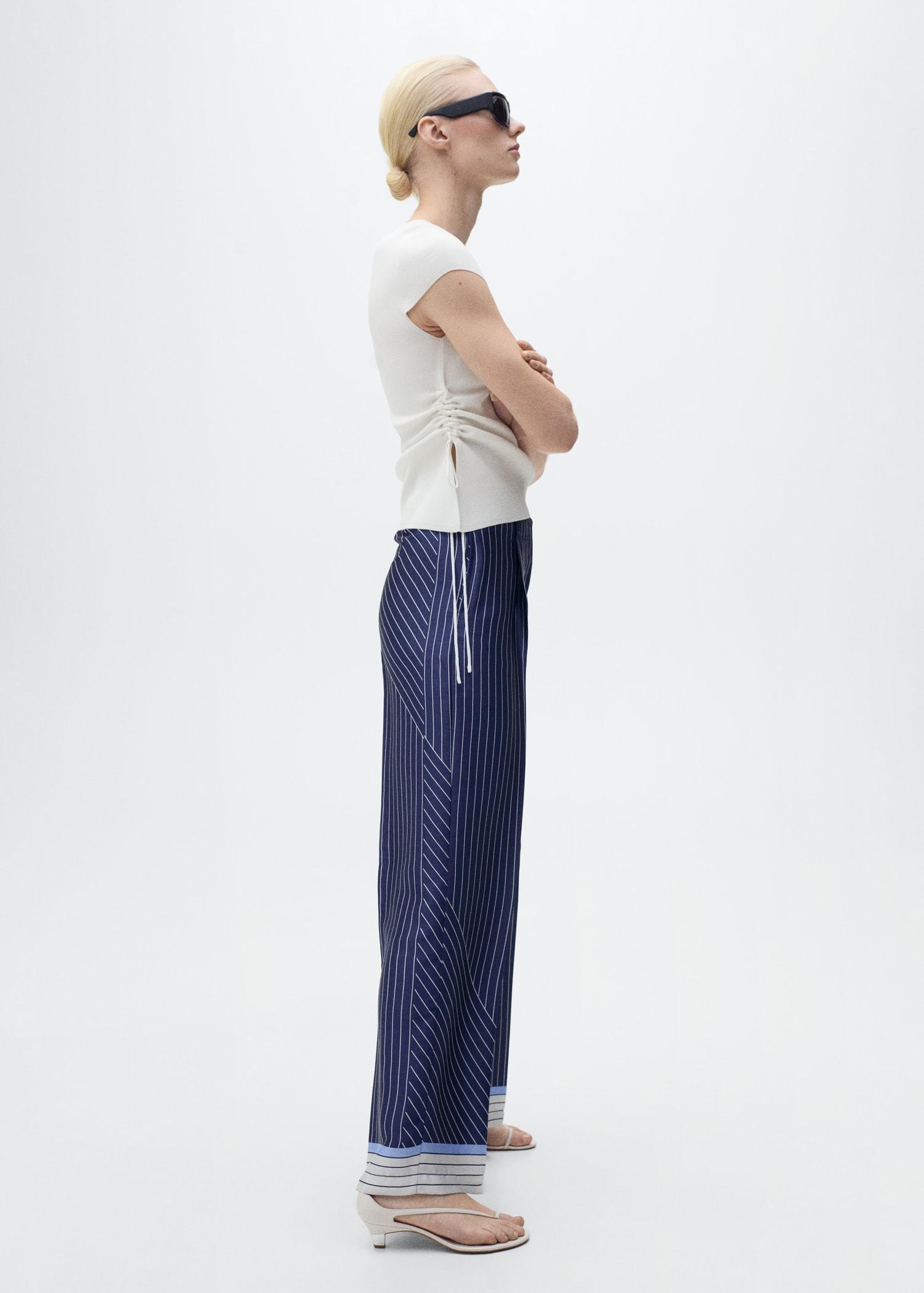 Knitted sweater with asymmetrical hem - Women | MANGO USA Product Image