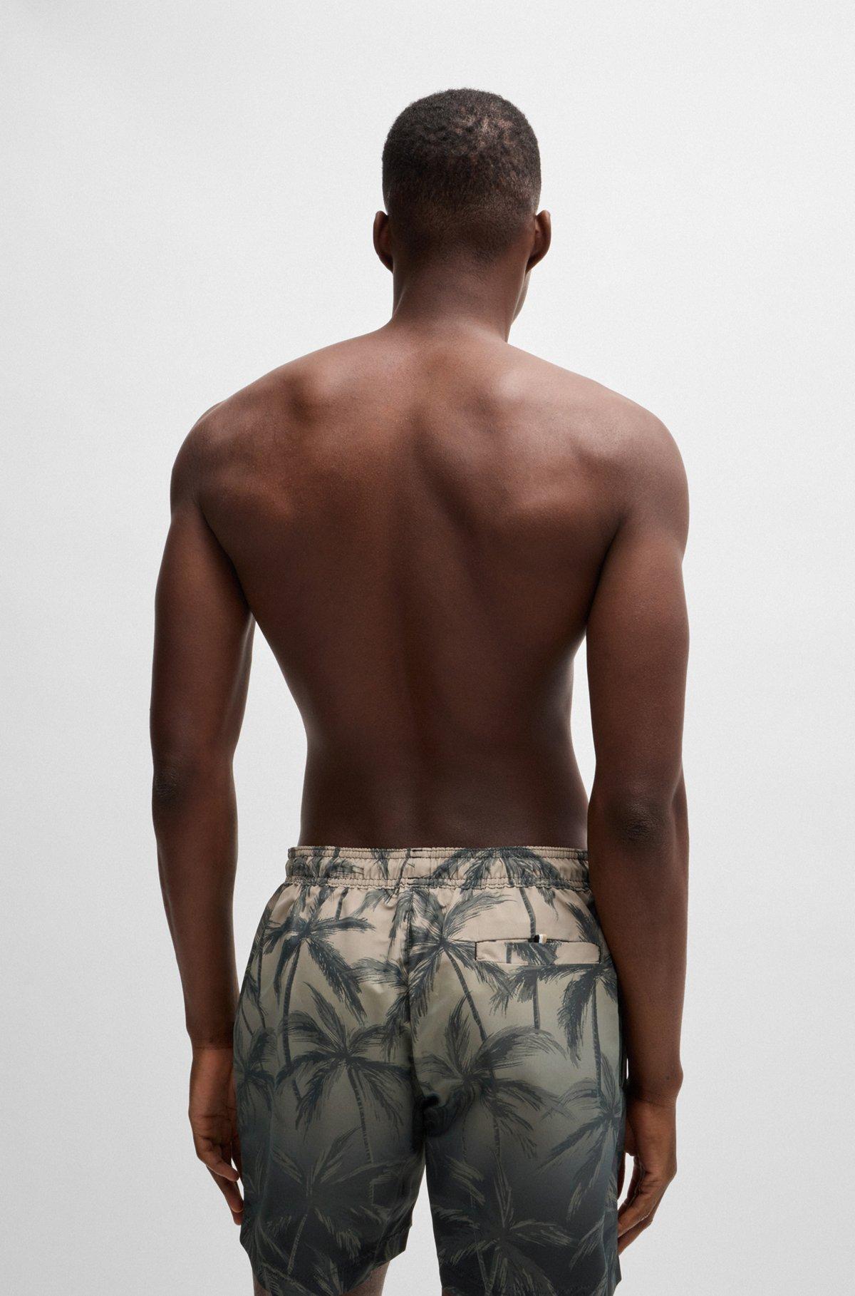 Quick-dry swim shorts with seasonal print Product Image
