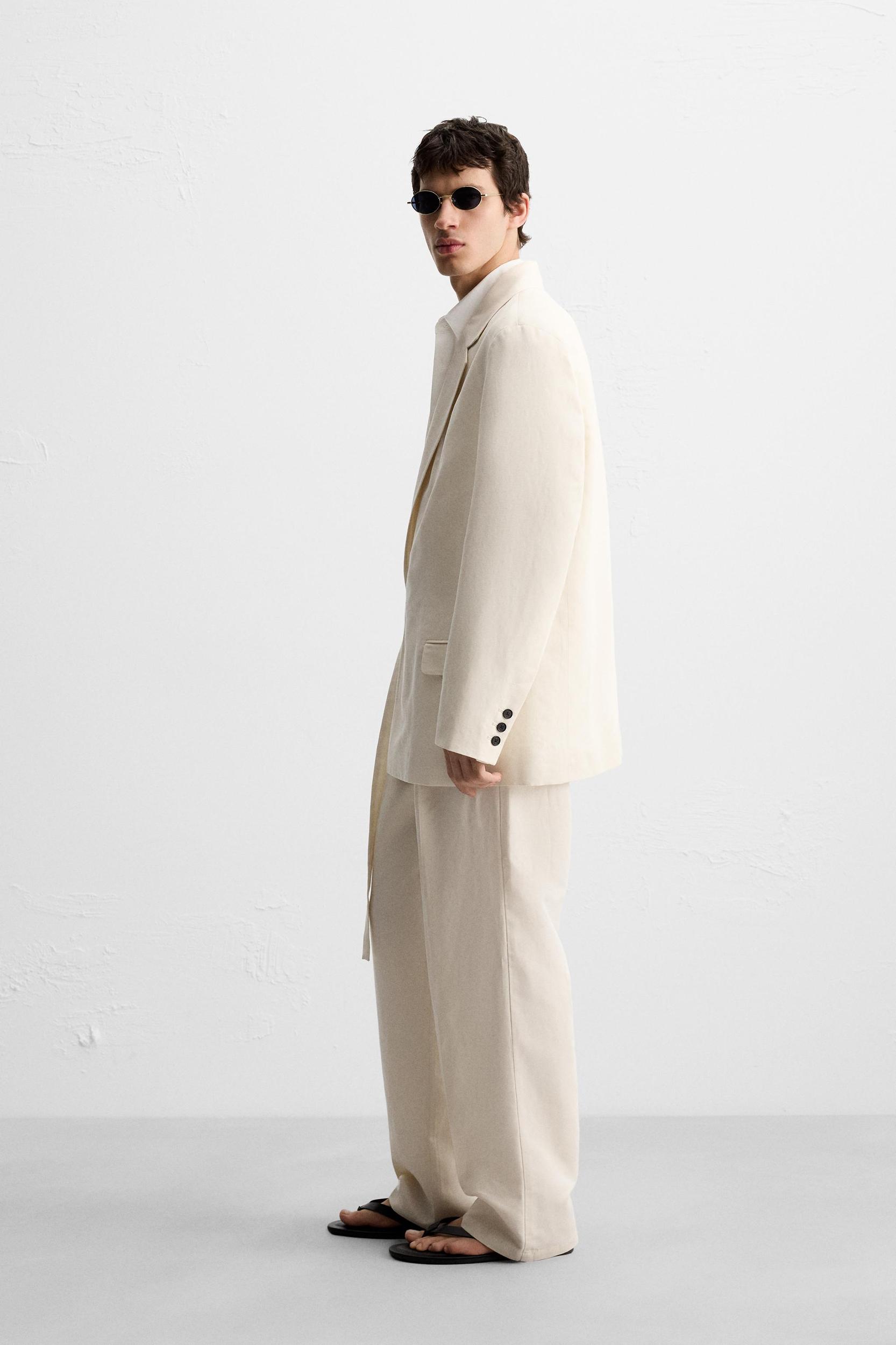 PLEATED SUIT PANTS Product Image