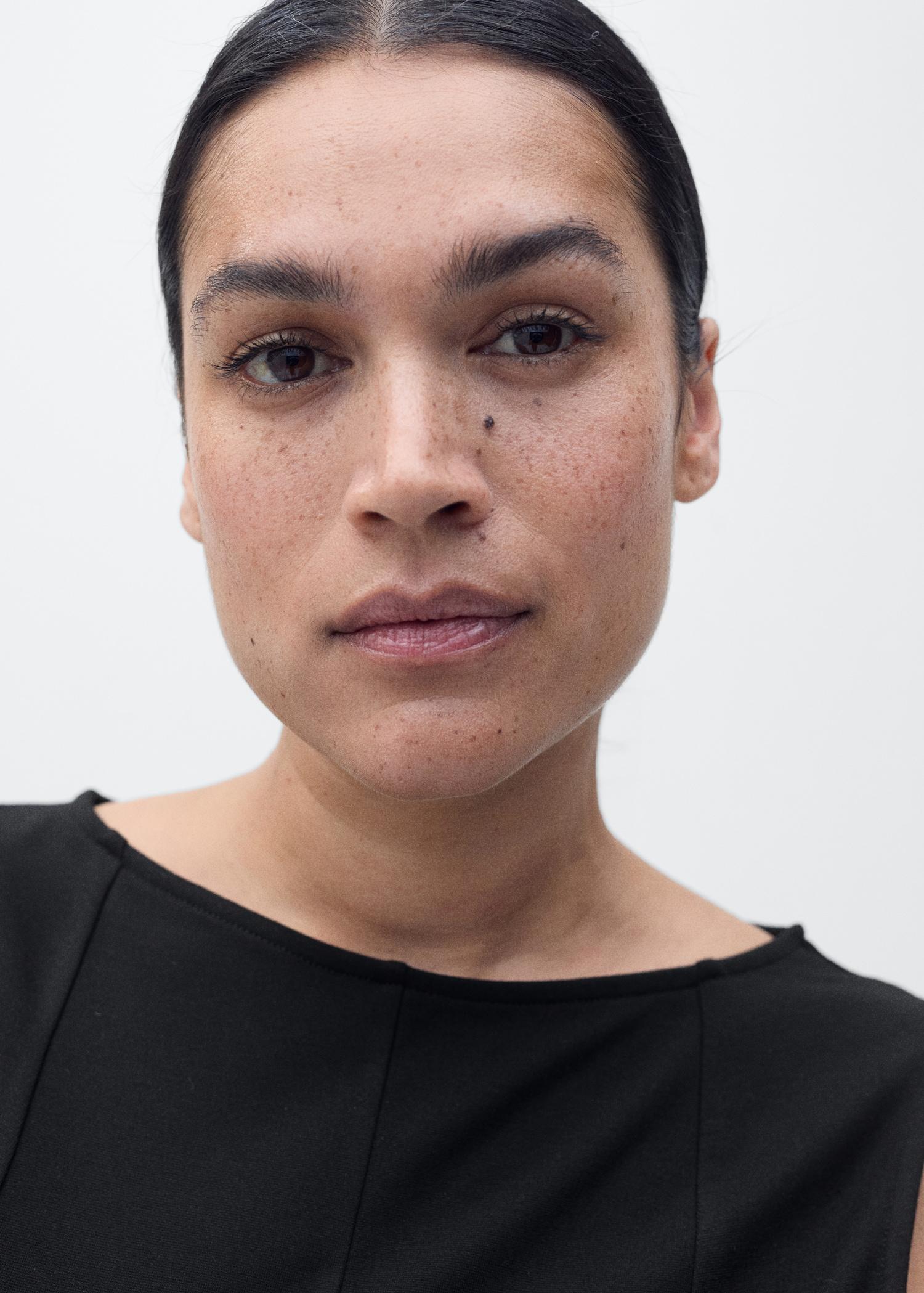 Peplum top with seam detail - Women | MANGO USA Product Image