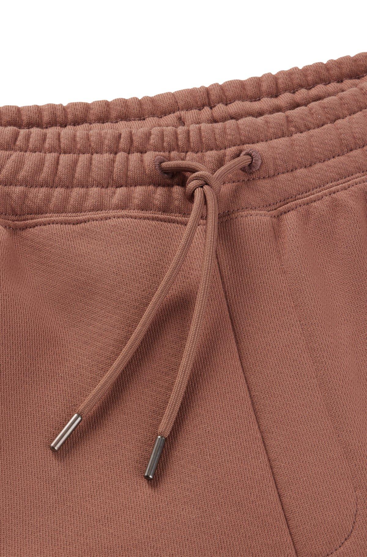 Cotton-terry tracksuit bottoms with logo print Product Image