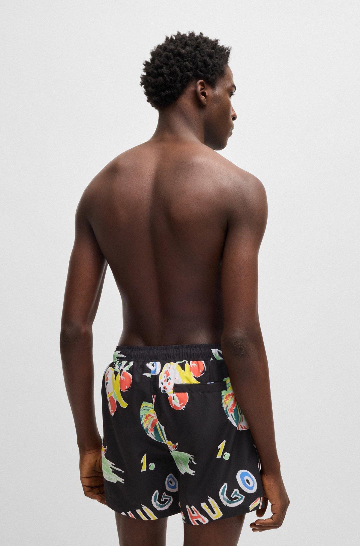 HUGO - Fully lined swim shorts with seasonal print - Black Product Image