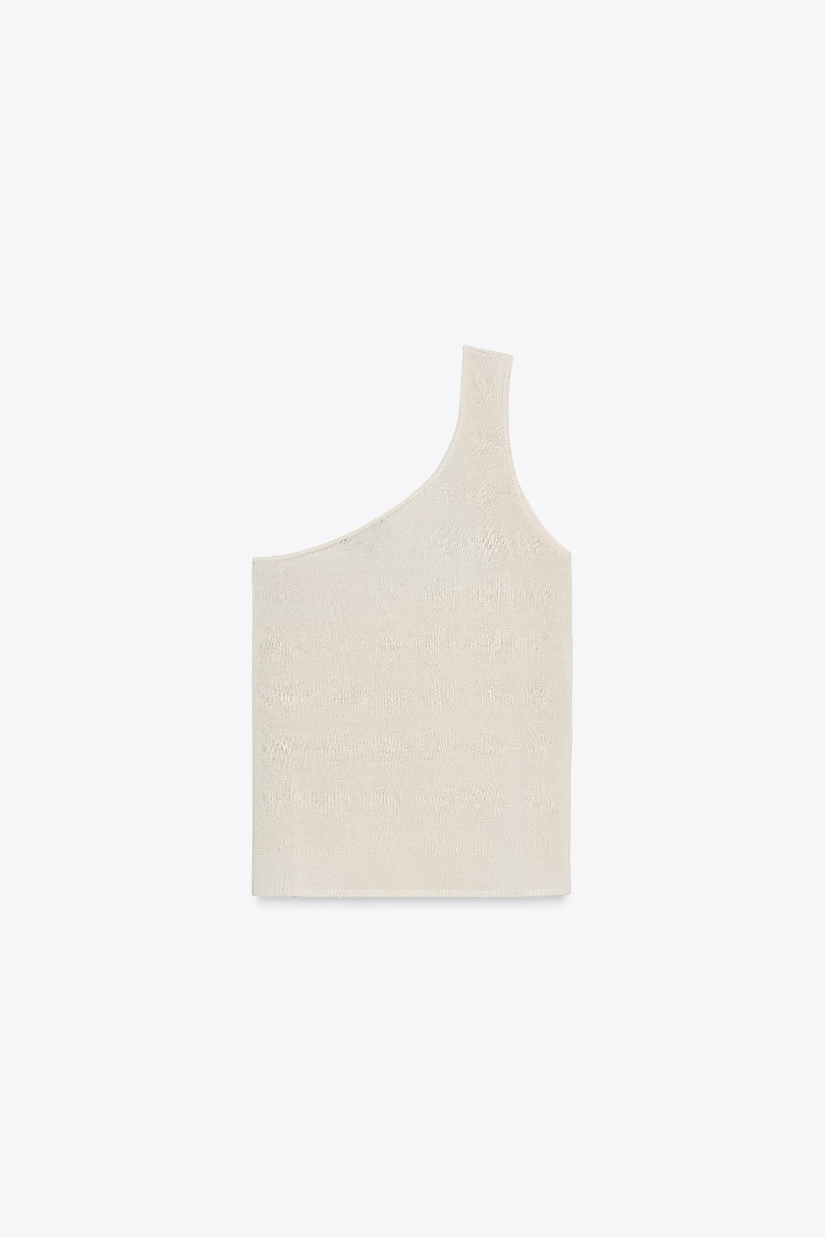 ASYMMETRIC KNIT TOP WITH HARDWARE Product Image