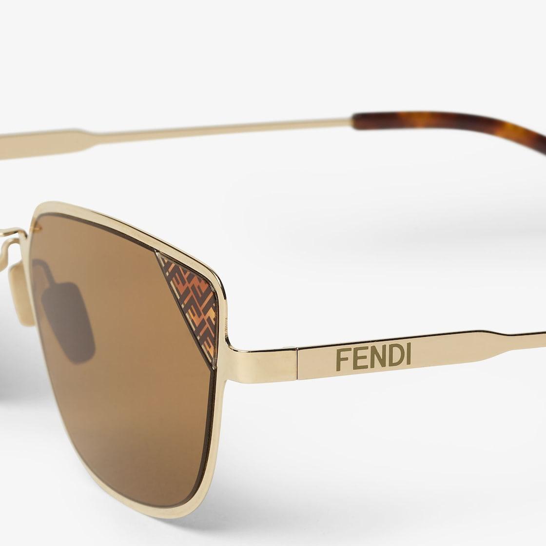 Fendi SignatureGold metal sunglasses with tobacco-color lenses Product Image