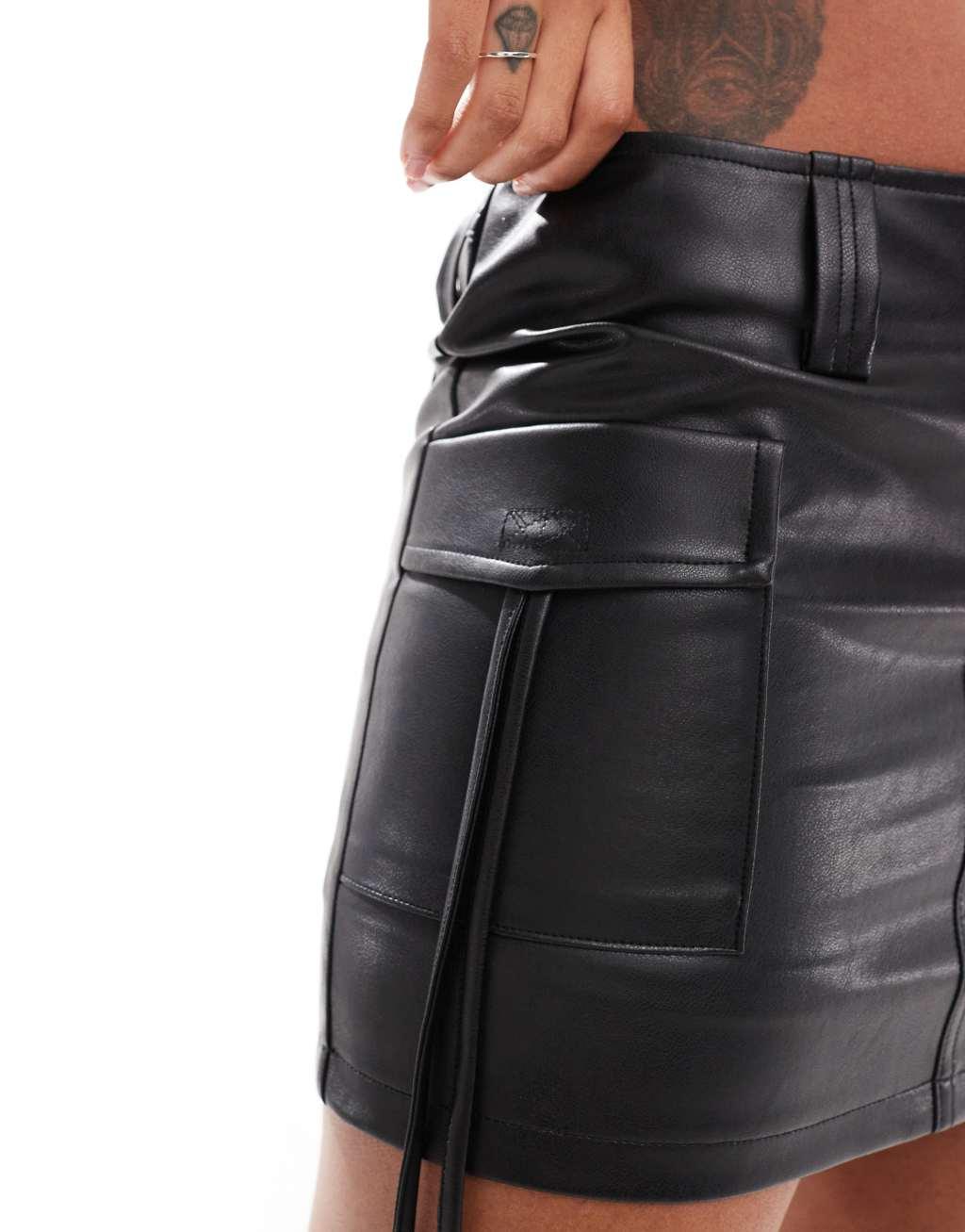 Aria Cove leather look tie side cargo mini skirt in black Product Image