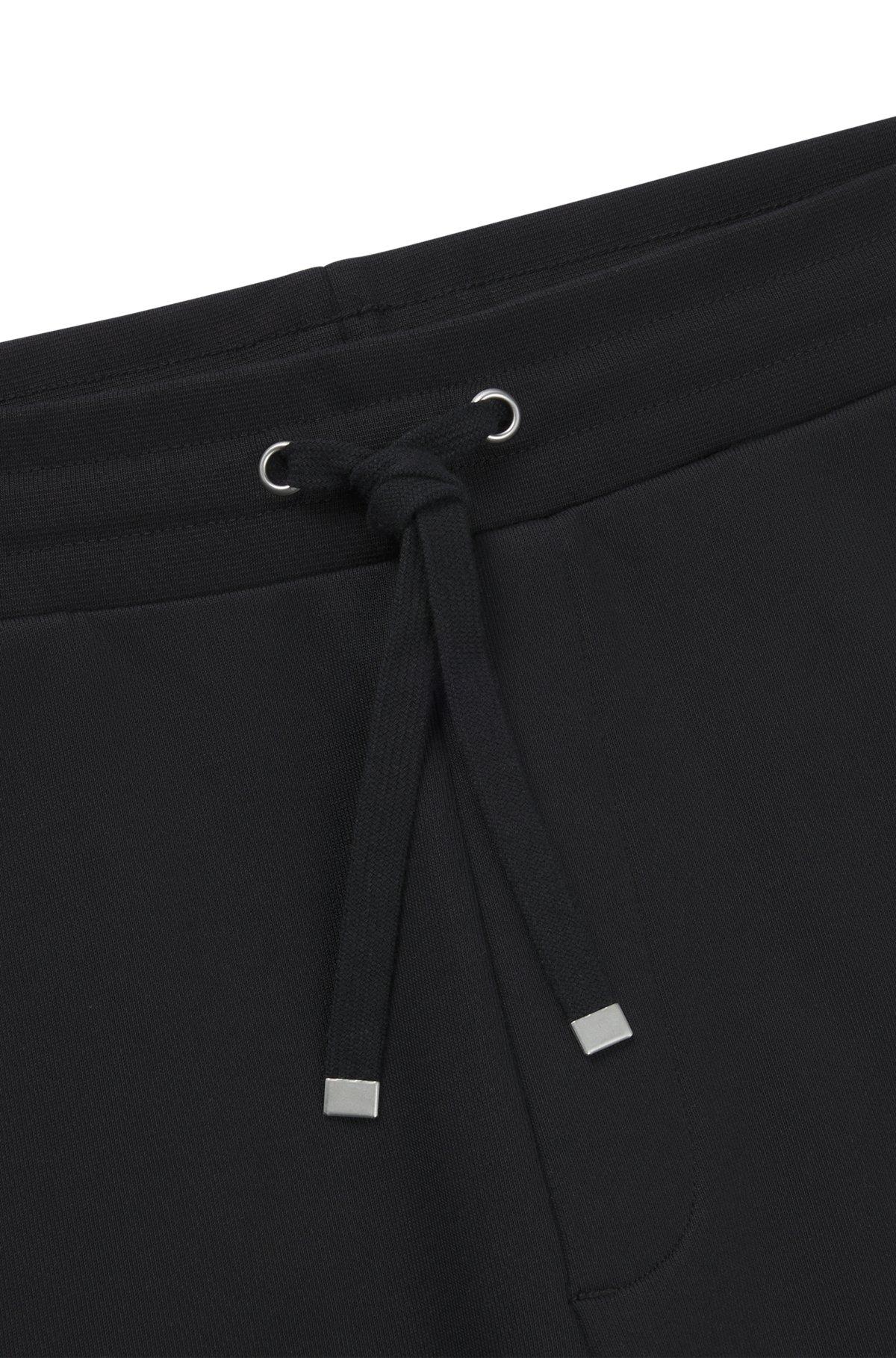 Cotton-terry tracksuit bottoms with smoke logo Product Image