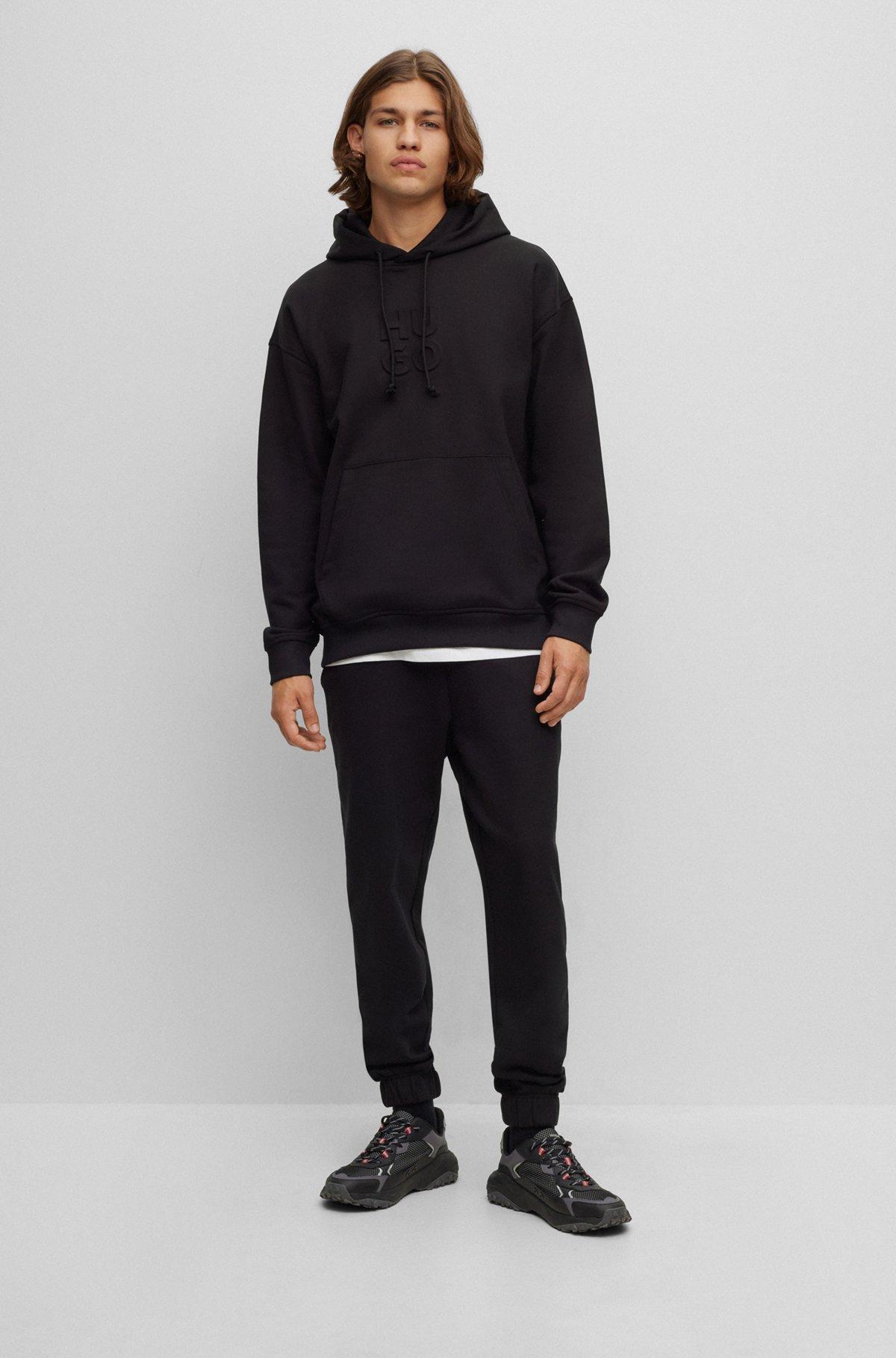 Relaxed-fit cotton-terry tracksuit bottoms with stacked logo Product Image
