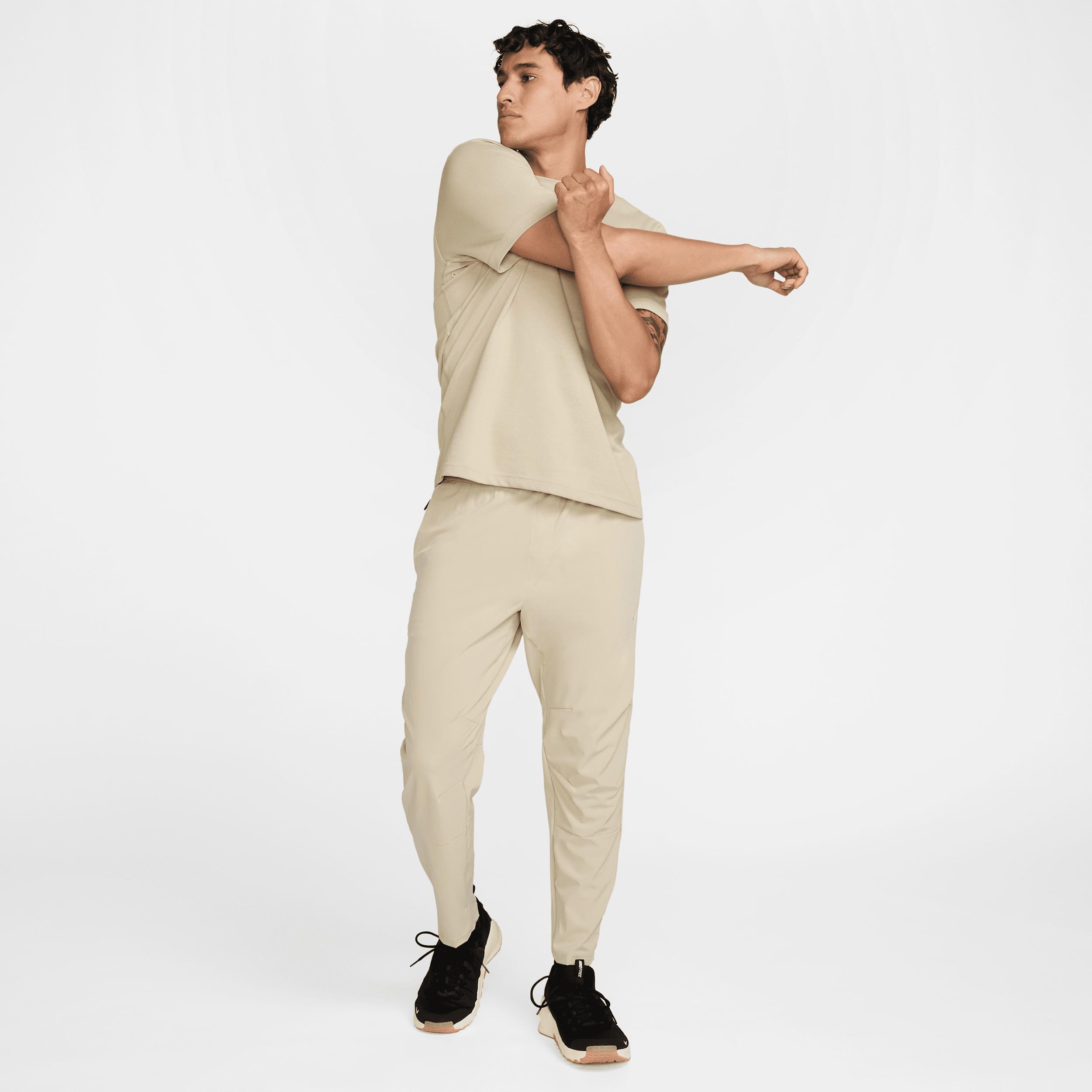 Nike Mens Unlimited Dri-FIT Tapered Leg Versatile Pants | FB7546-251 Product Image