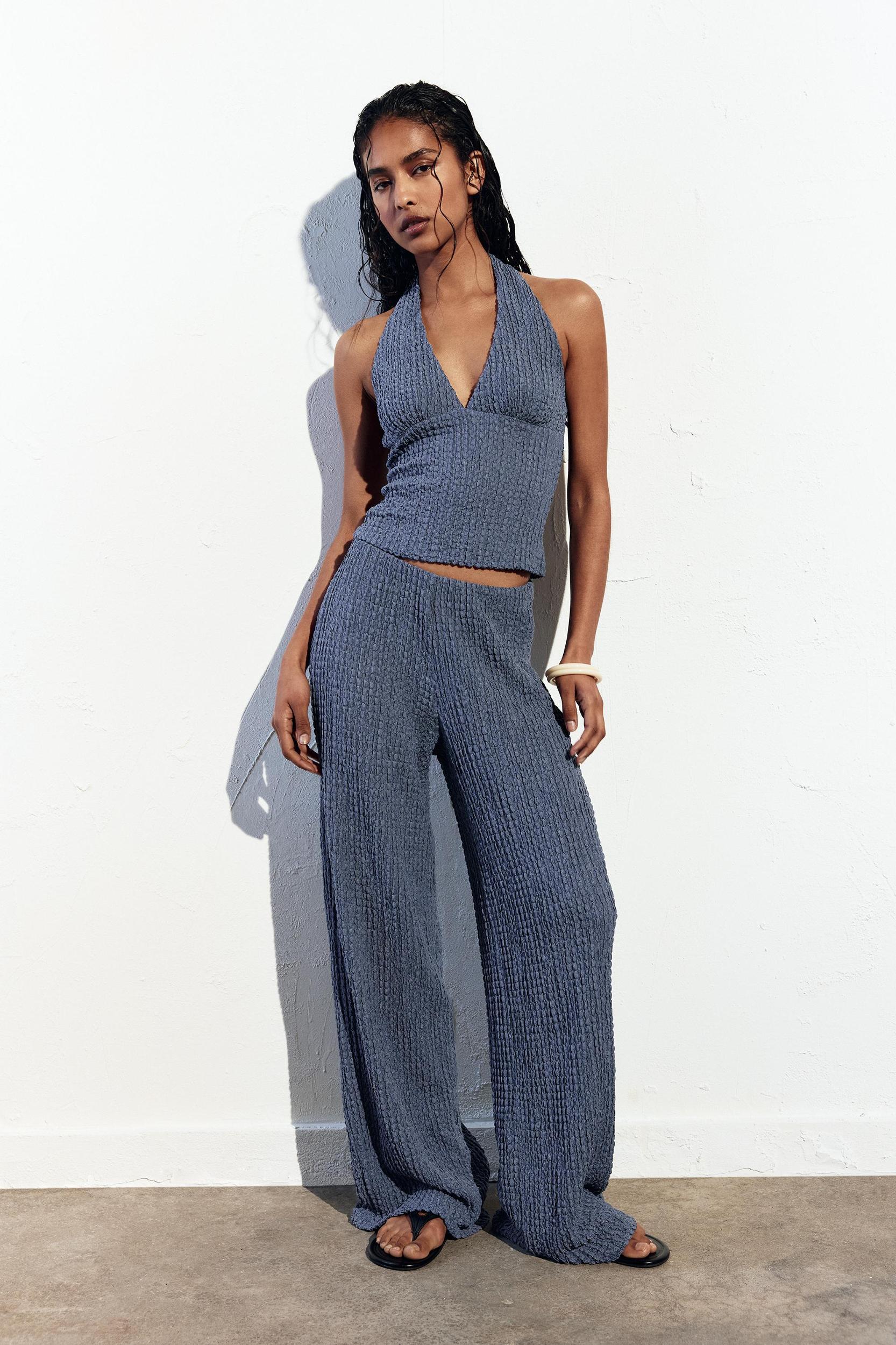 Rustic creased-effect pants Product Image