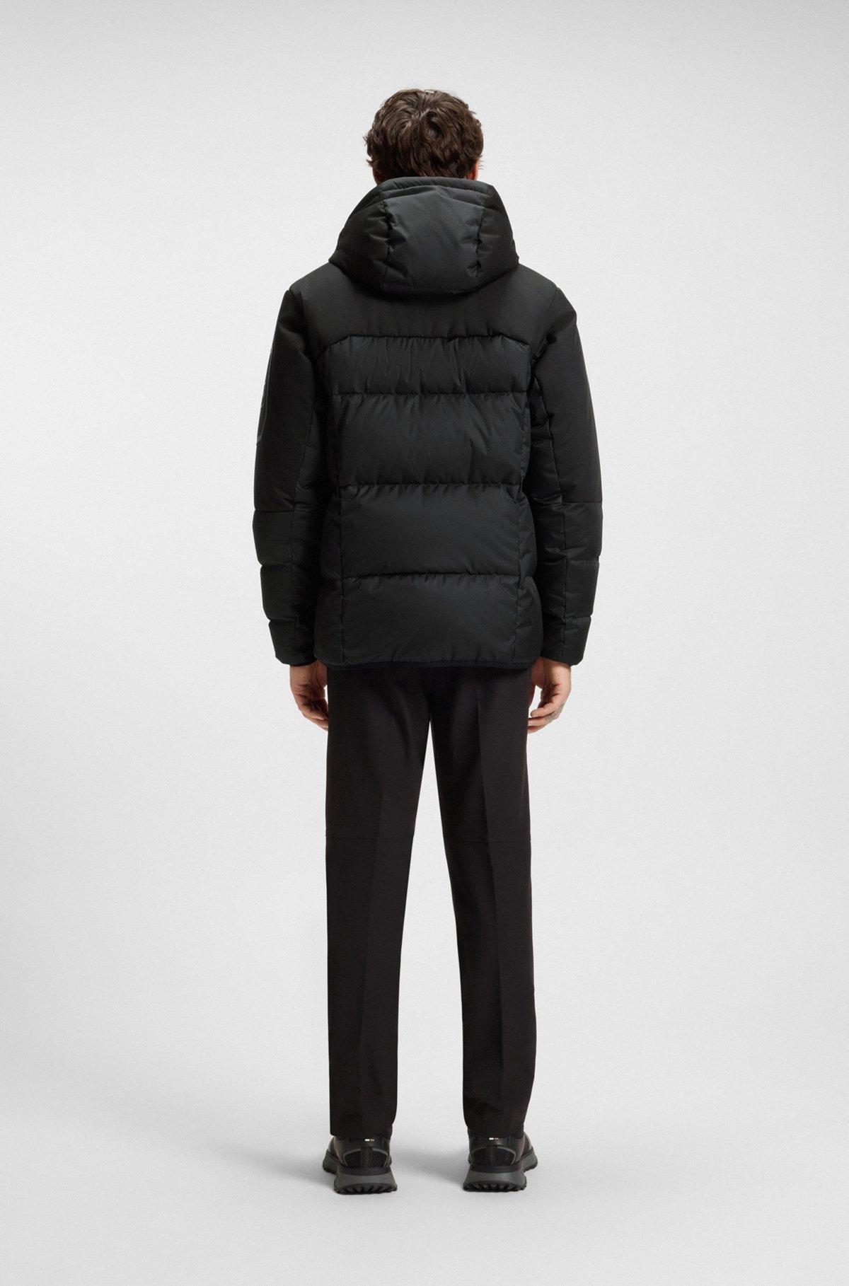 Water-repellent down jacket with detachable hood and sleeves Product Image