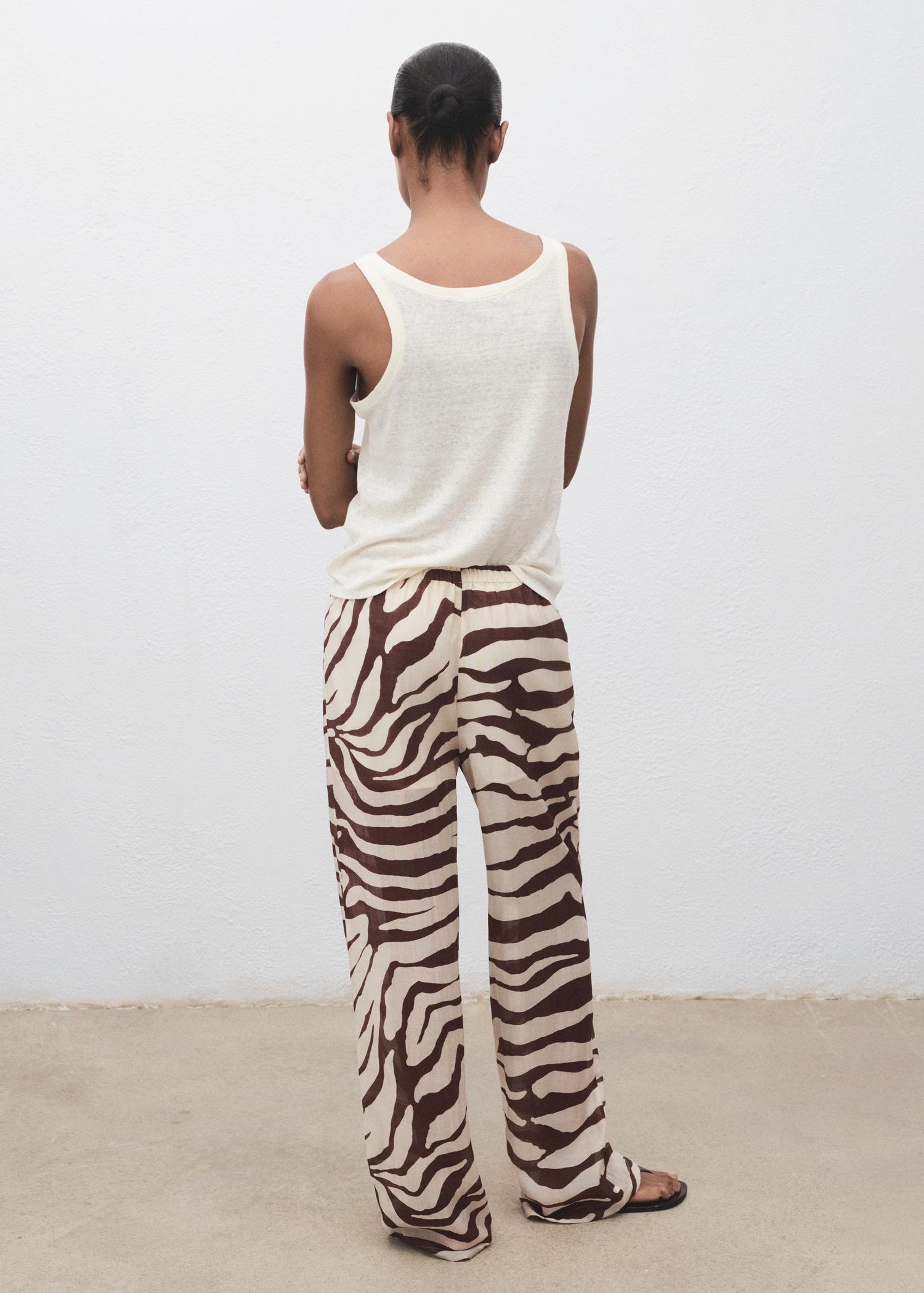 Zebra-print fluid pants - Women | MANGO USA Product Image
