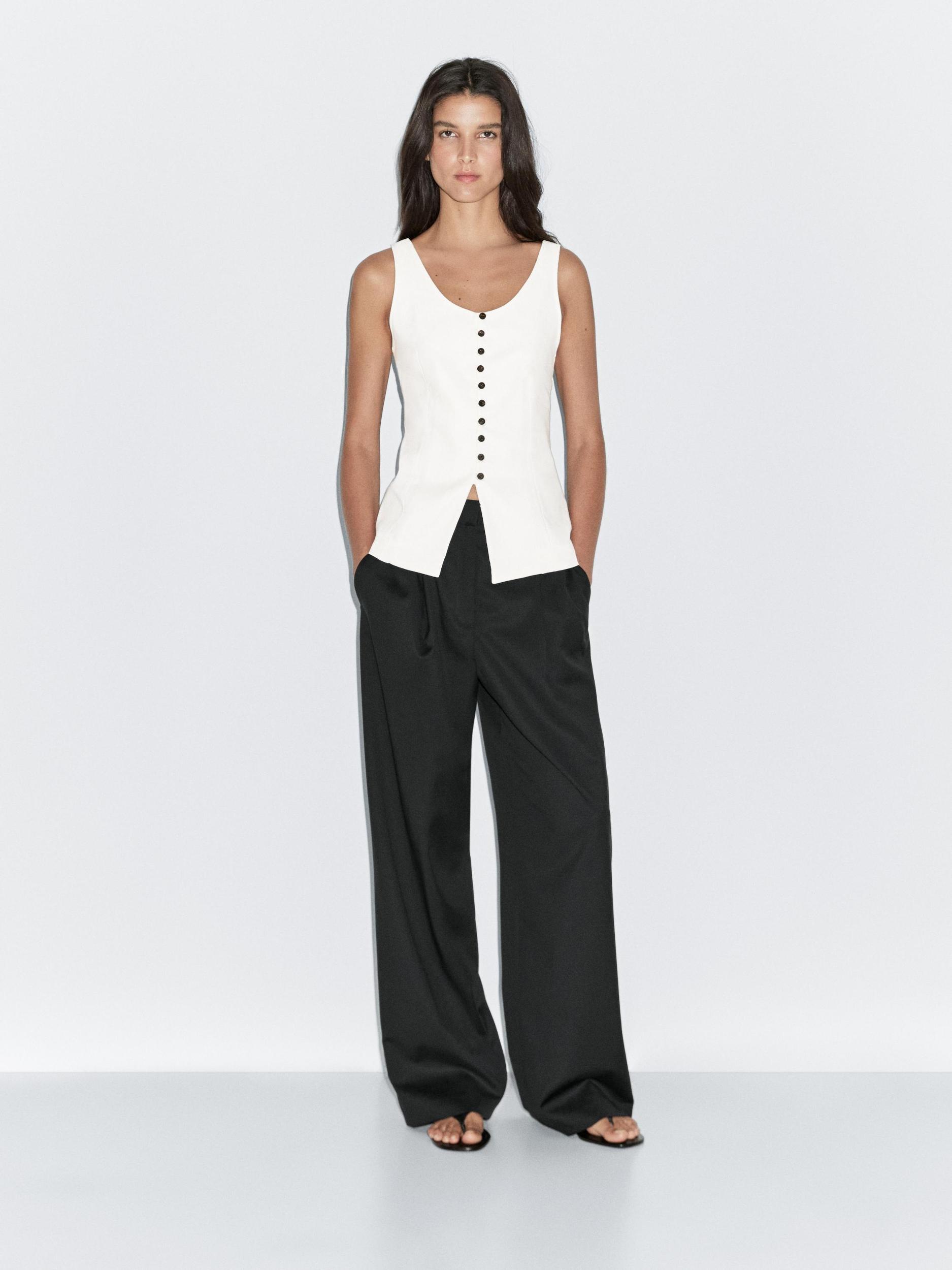 Wide-leg flowing trousers with darts Product Image
