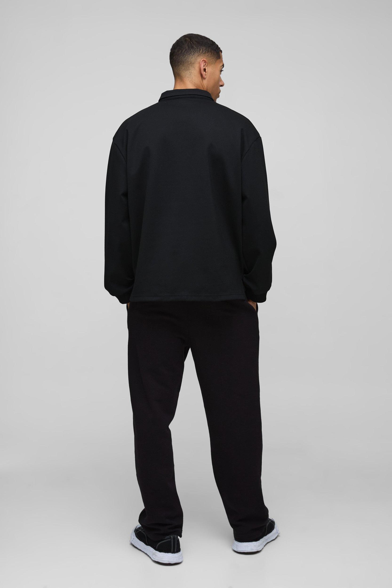 Oversized Worldwide Applique Half Zip Rugby Polo | boohooMAN USA Product Image