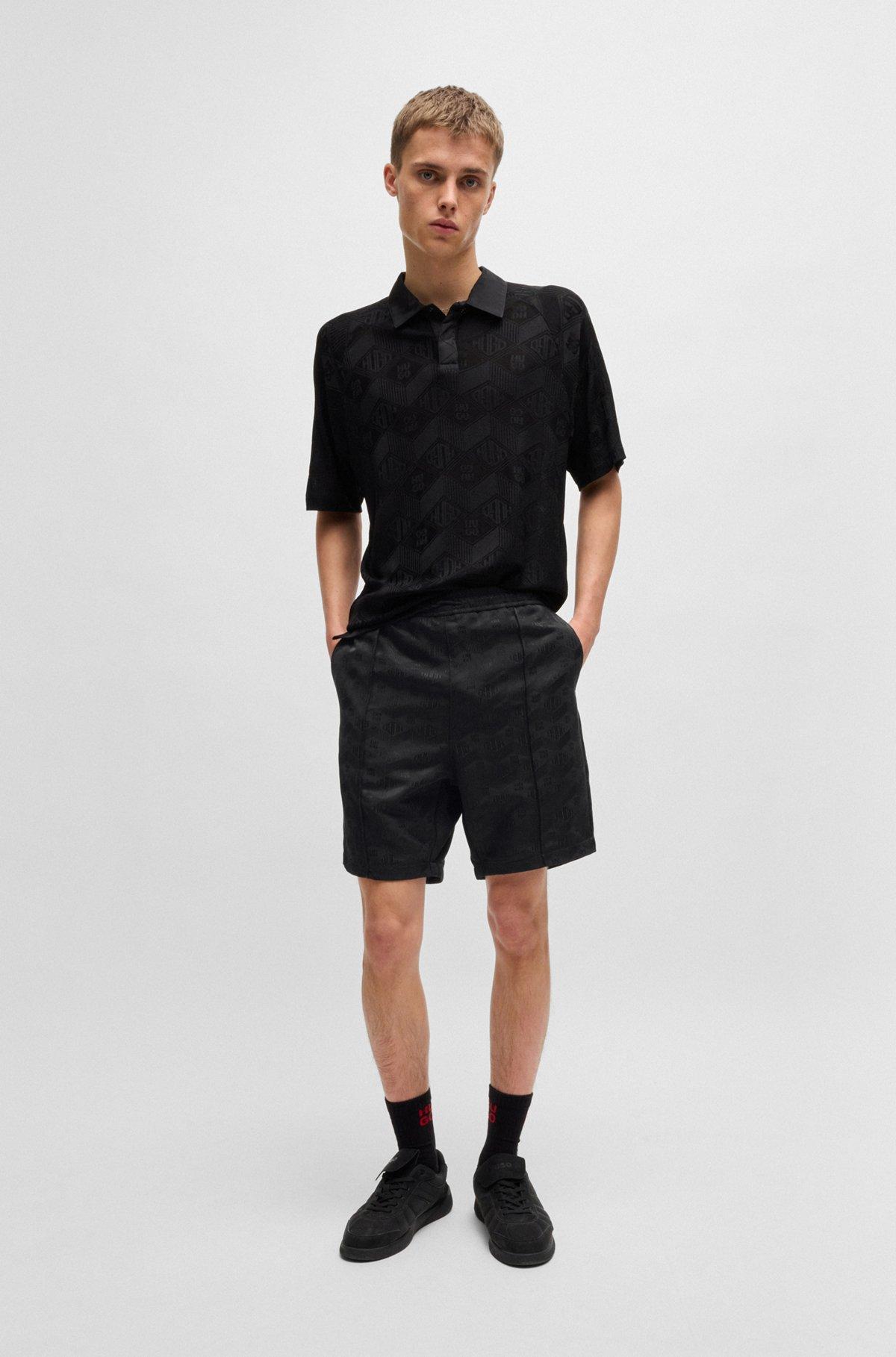 Relaxed-fit shorts with geometric logos Product Image
