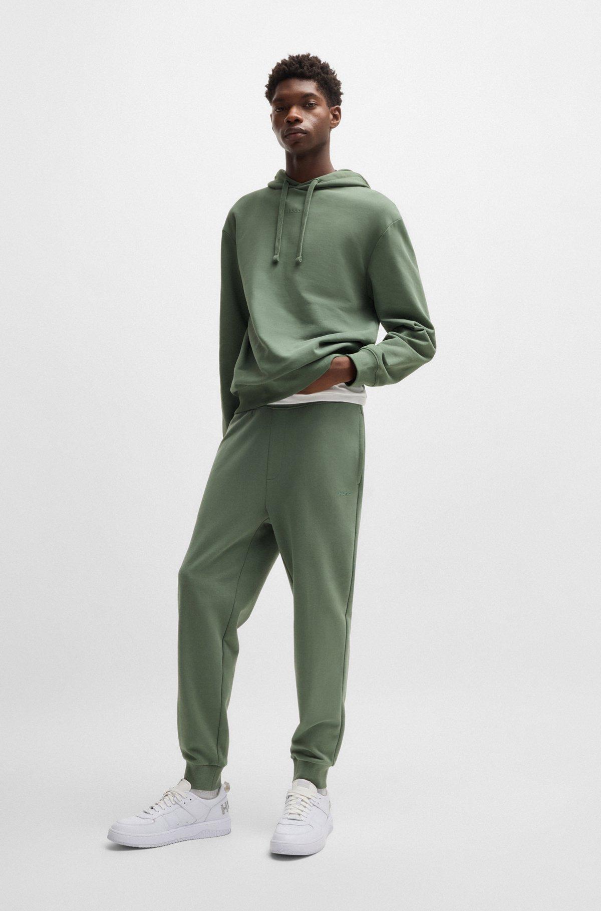 Cuffed tracksuit bottoms in cotton terry with logo print Product Image