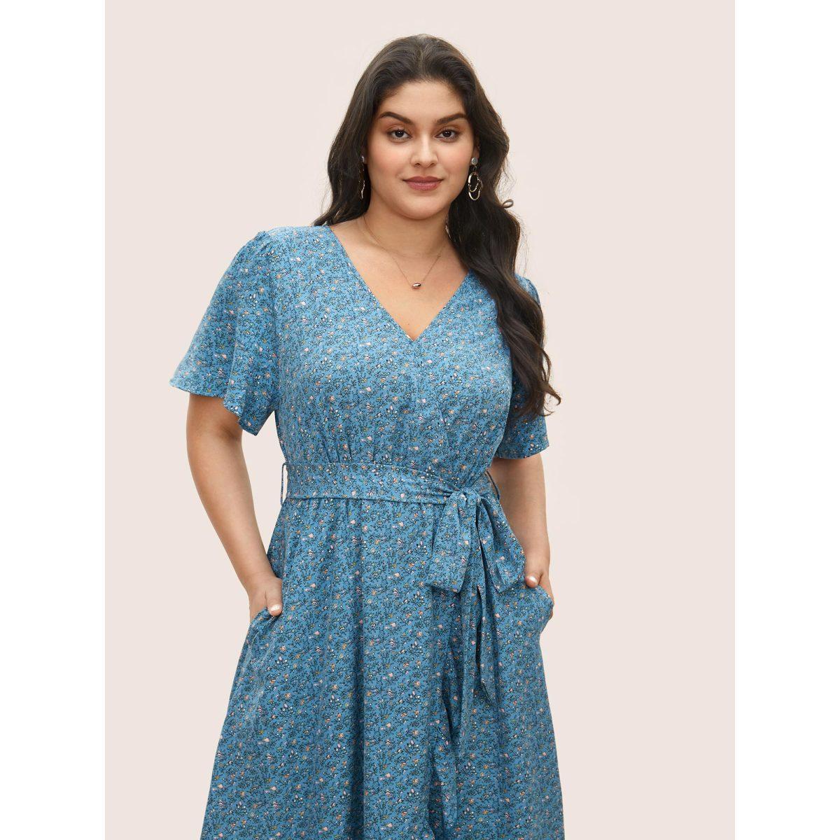 Plus Size Ditsy Floral Overlap Collar Ruffles Belted Dress Blue Women Elegant Overlapping Overlap Collar Short sleeve Curvy Midi Dress BloomChic 12/L Product Image