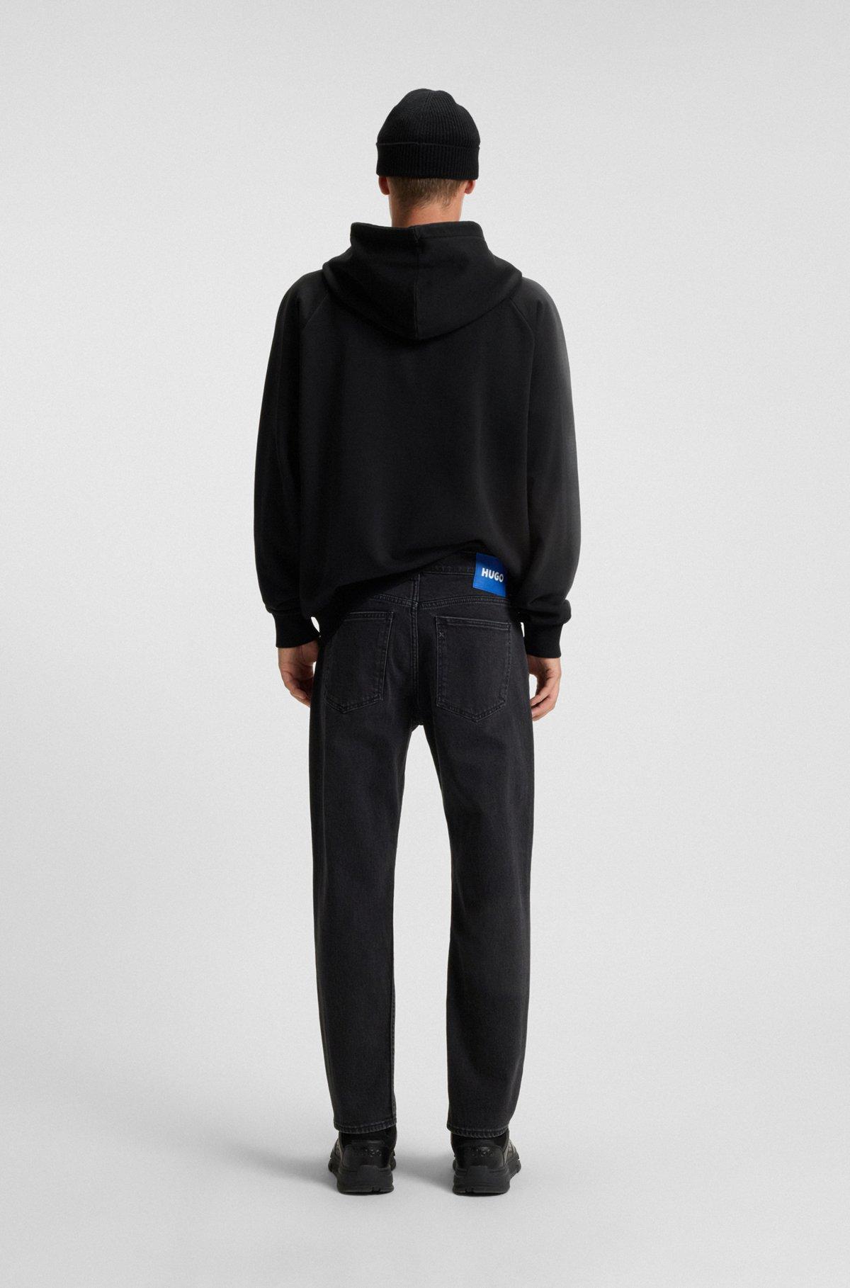 Tapered-fit jeans in grain-effect black denim Product Image