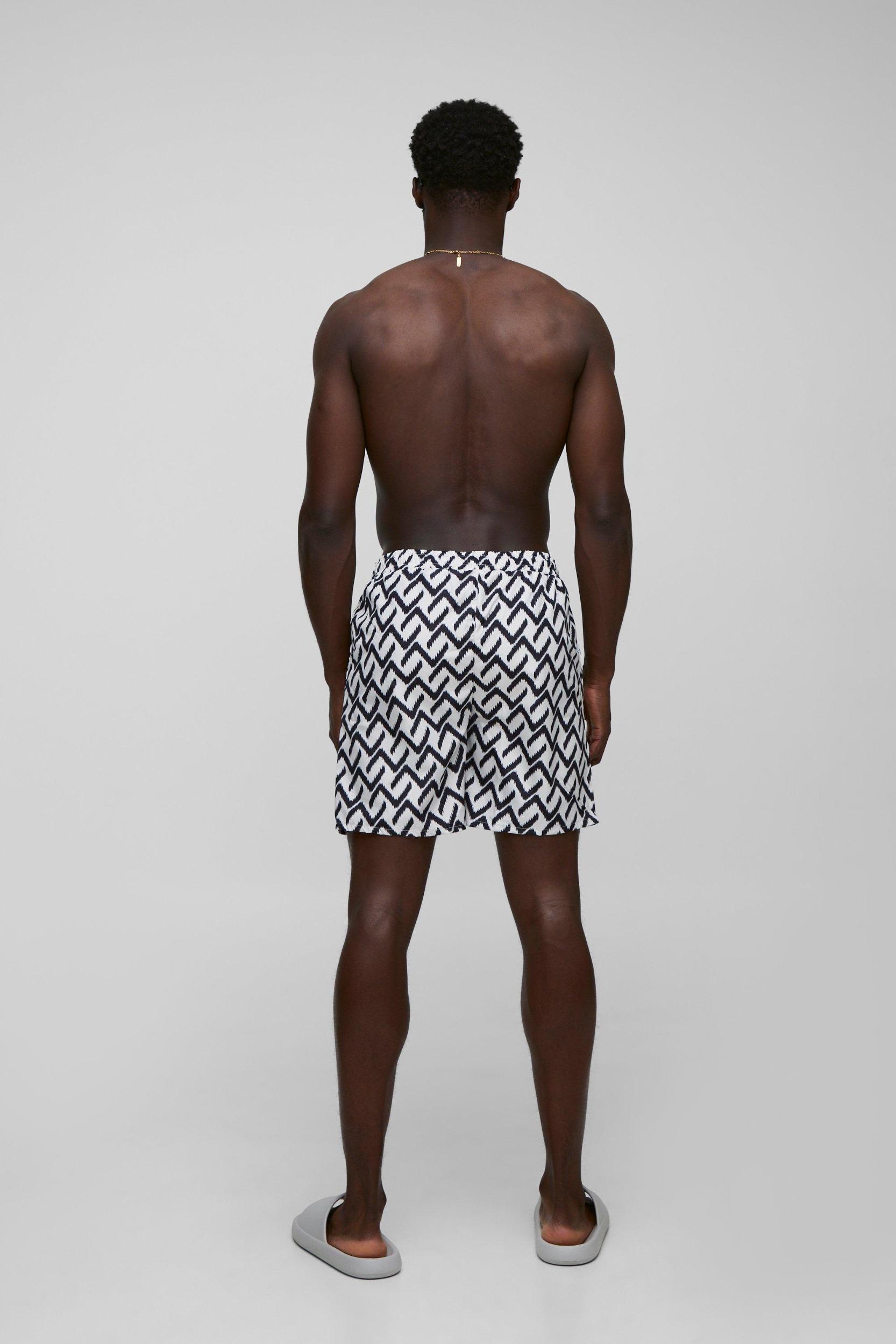 Abstract Pattern Printed Mid Length Swim Short | boohooMAN USA Product Image
