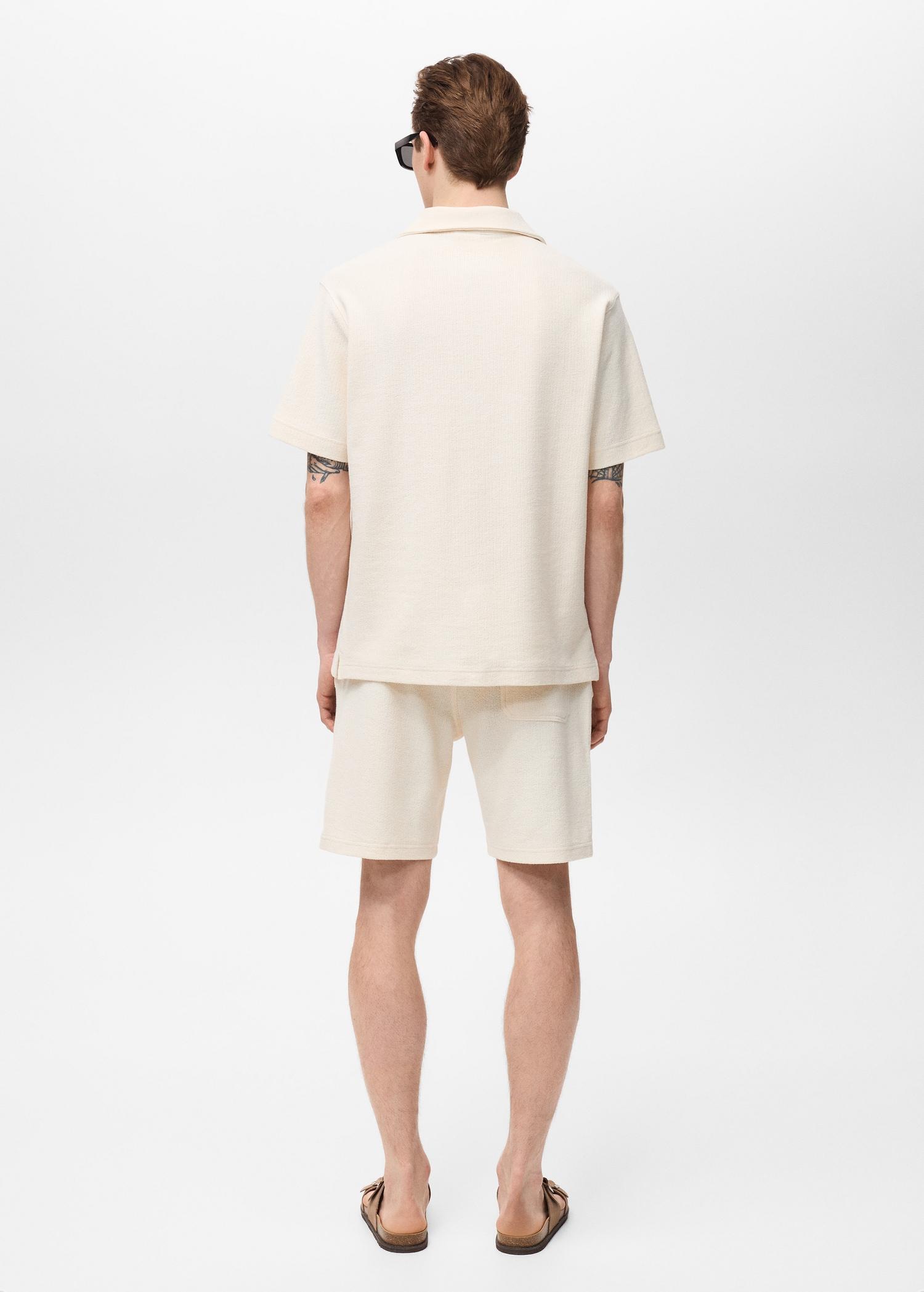 Regular-fit textured polo shirt - Men | MANGO USA Product Image