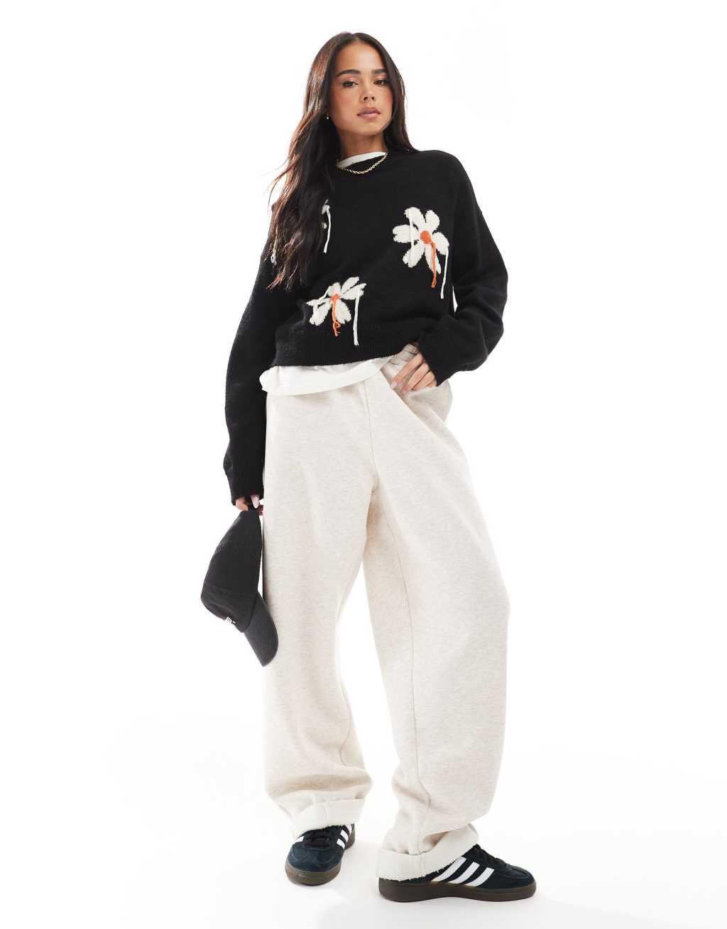 ASOS DESIGN knit sweater with tassel floral in black Product Image
