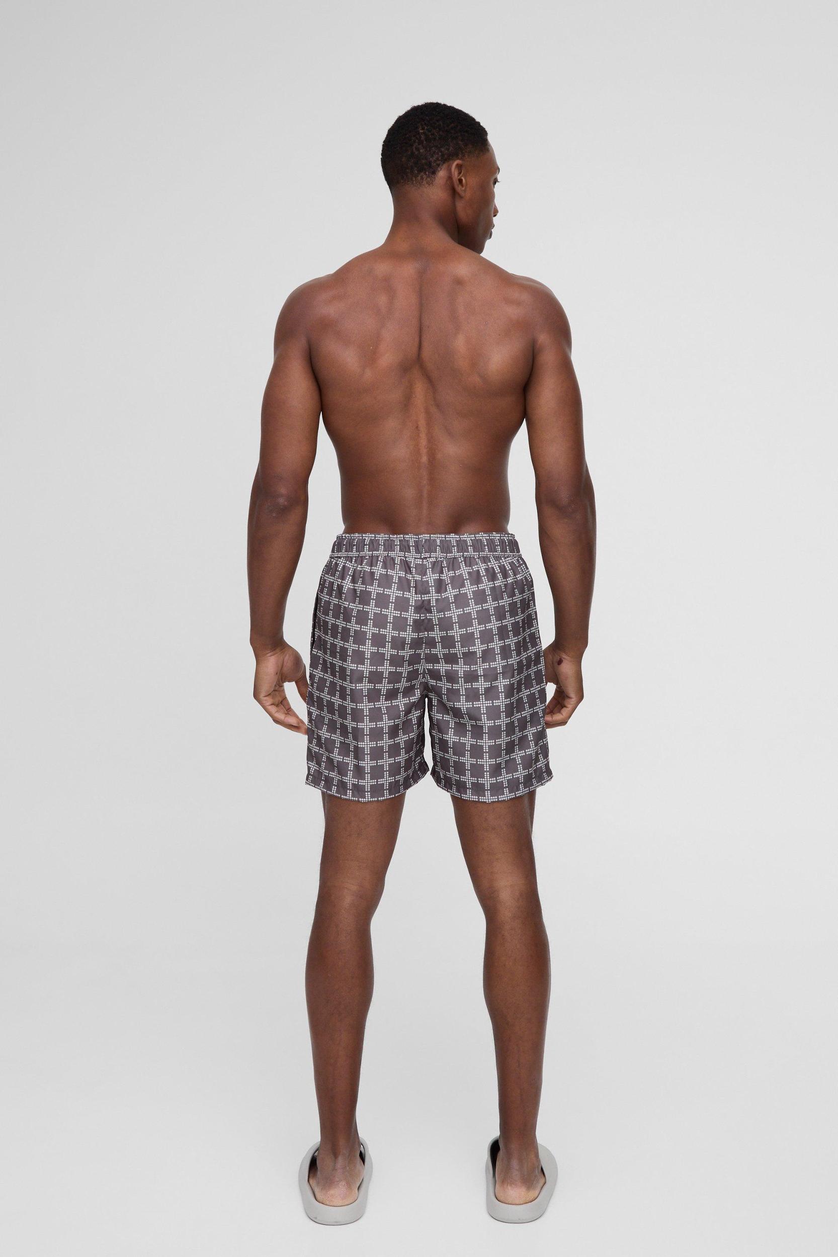Mid Length Plaid Swim Trunks | boohooMAN USA Product Image