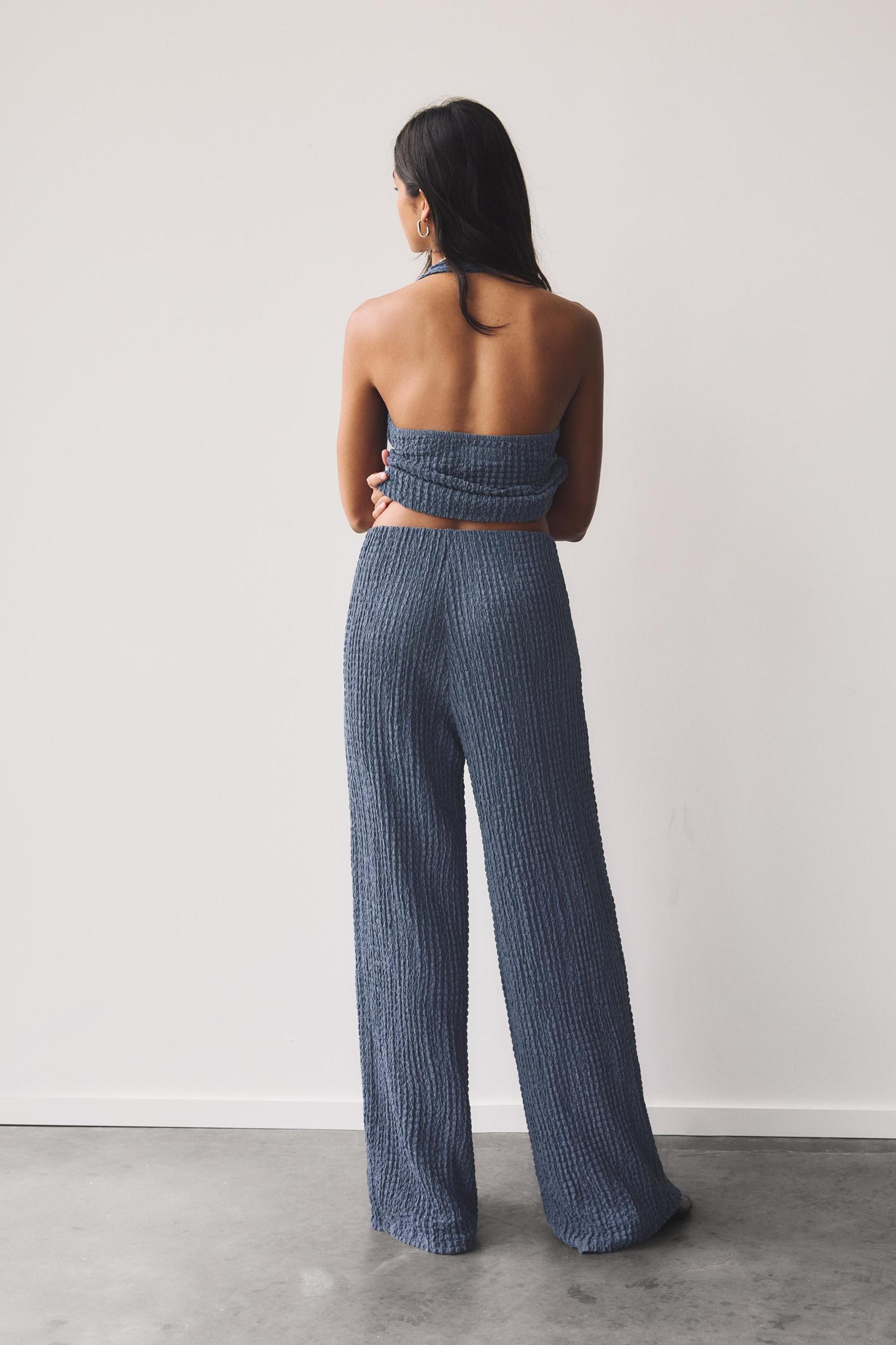 Rustic creased-effect pants Product Image