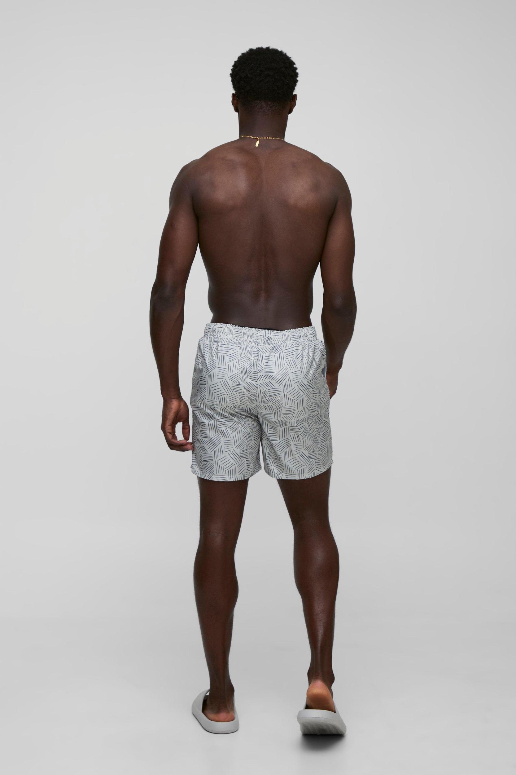 Abstract Printed Mid Length Swim Short | boohooMAN USA Product Image