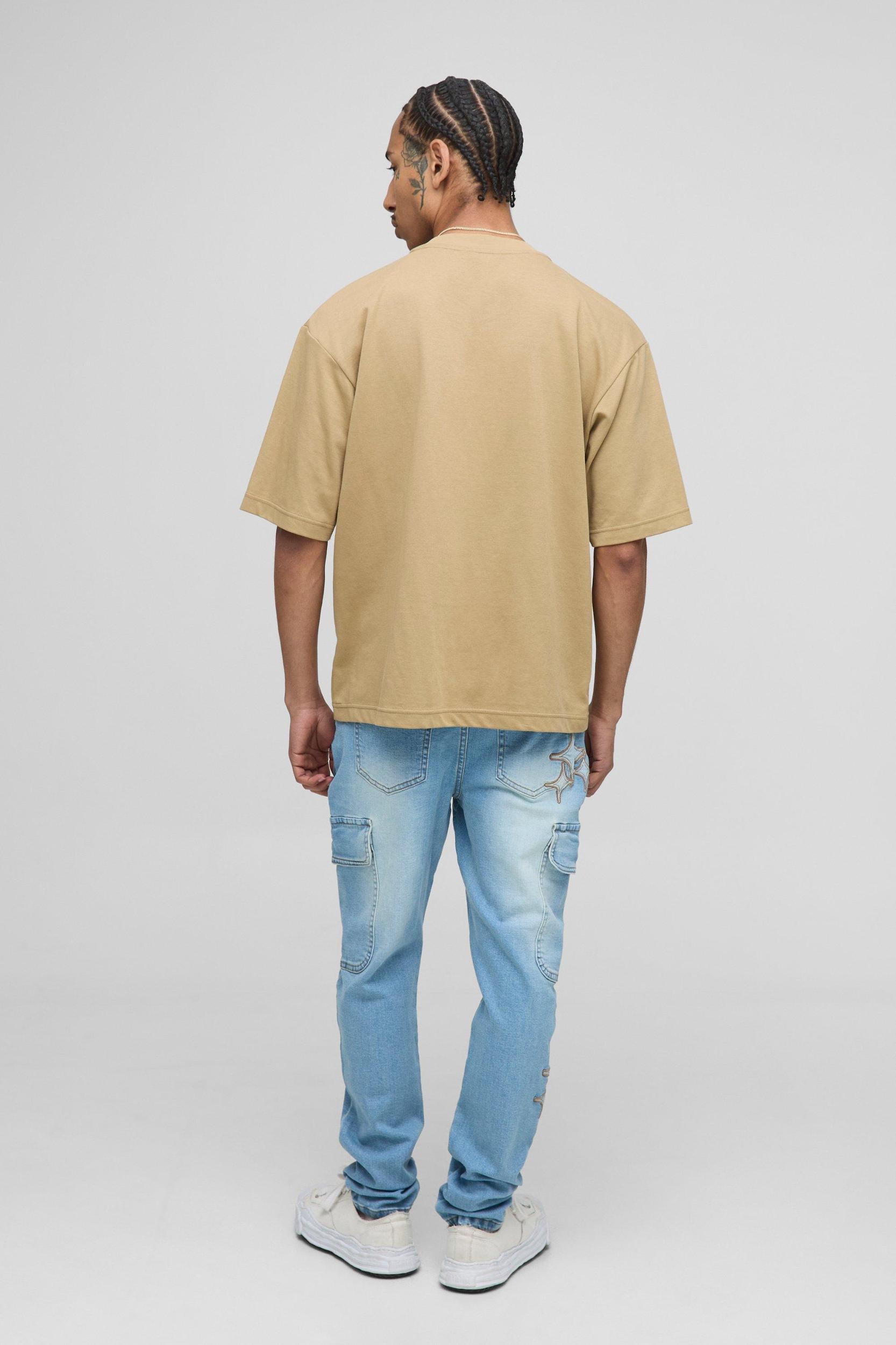 Skinny Star Applique Cargo Jeans | boohooMAN USA Product Image