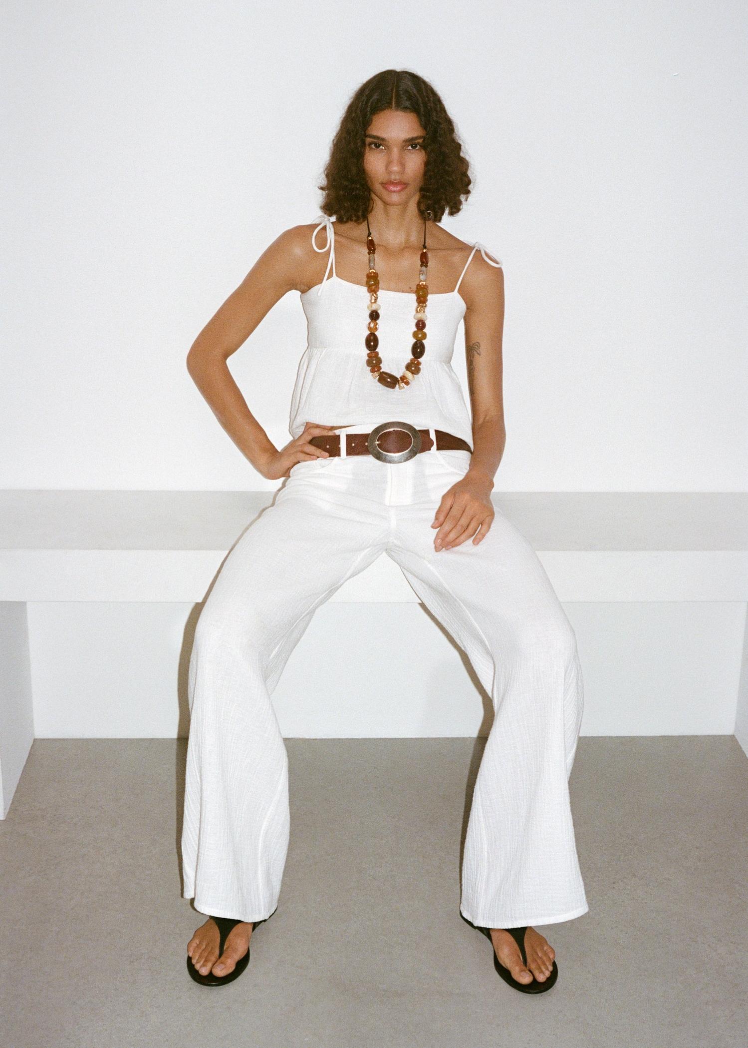 Cotton top with ruffles - Women | MANGO USA Product Image