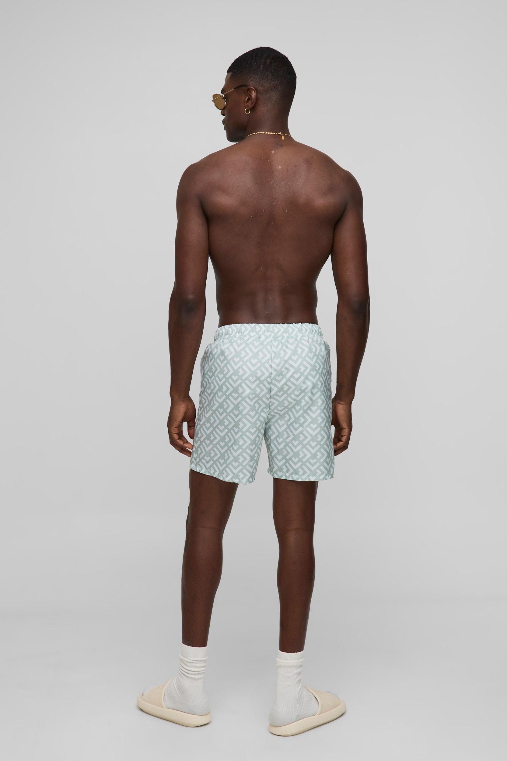 Geo Pattern Mid Length Swim Short | boohooMAN USA Product Image