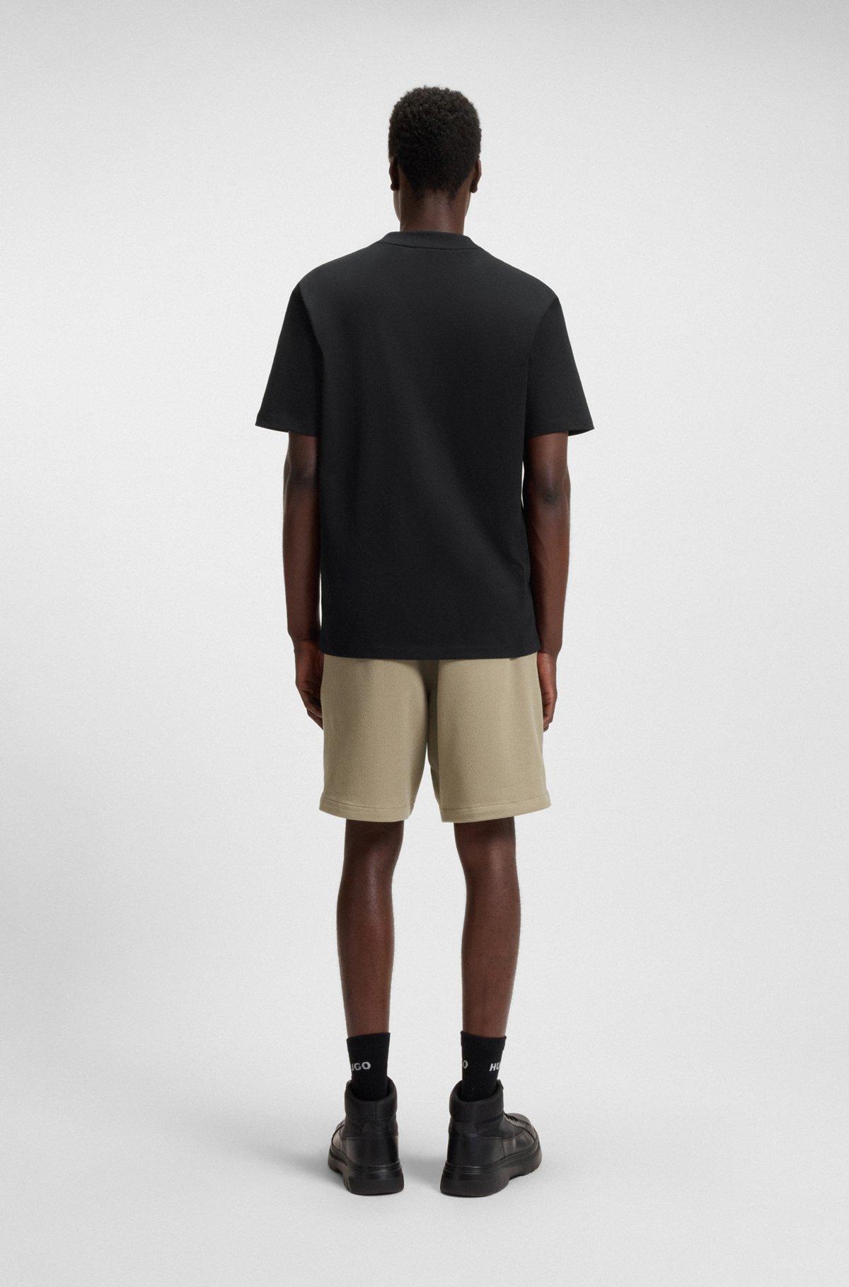 HUGO - Relaxed-fit T-shirt in cotton with logo print - Black Product Image