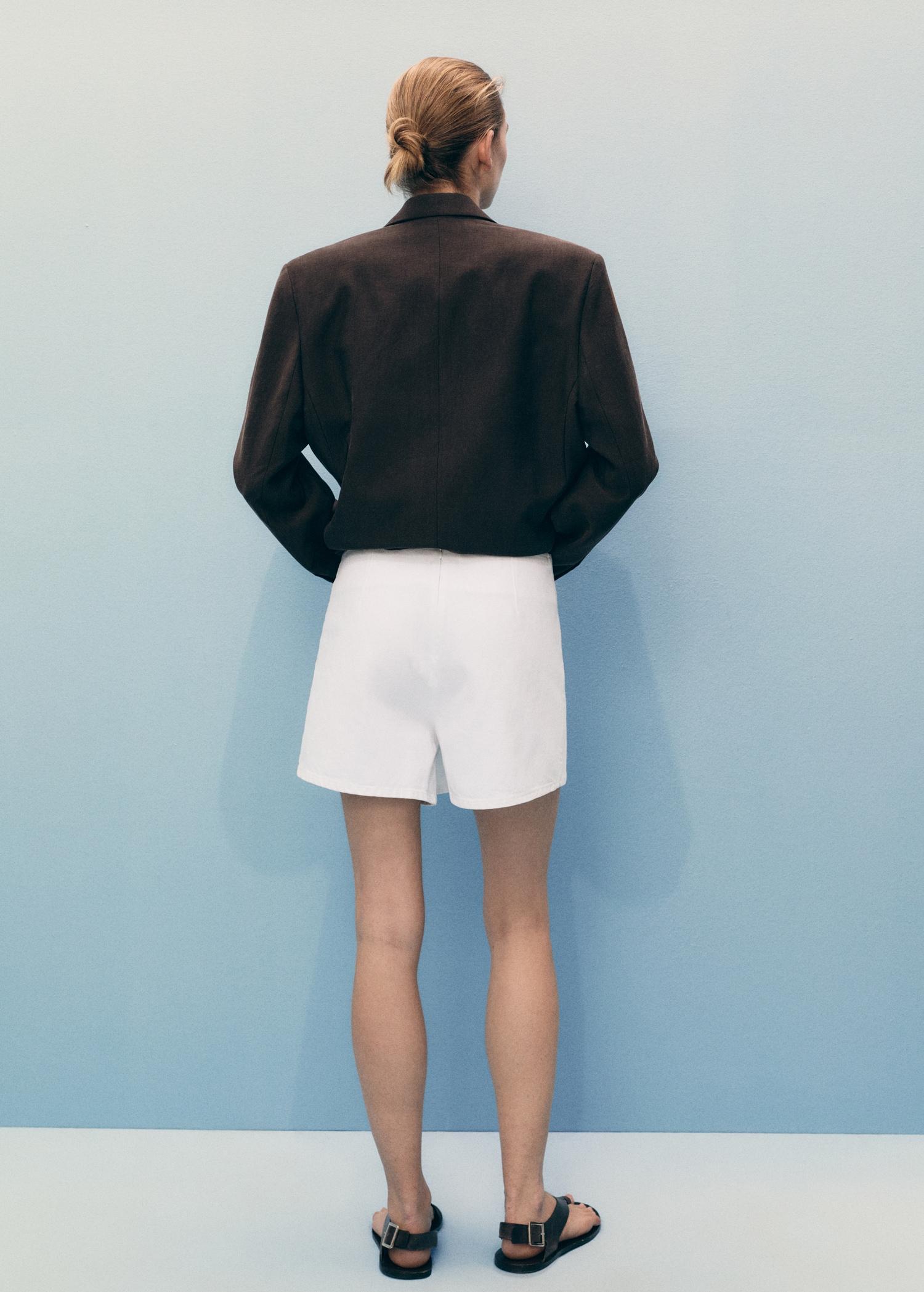 Wrapped denim skort - Women | MANGO USA Product Image