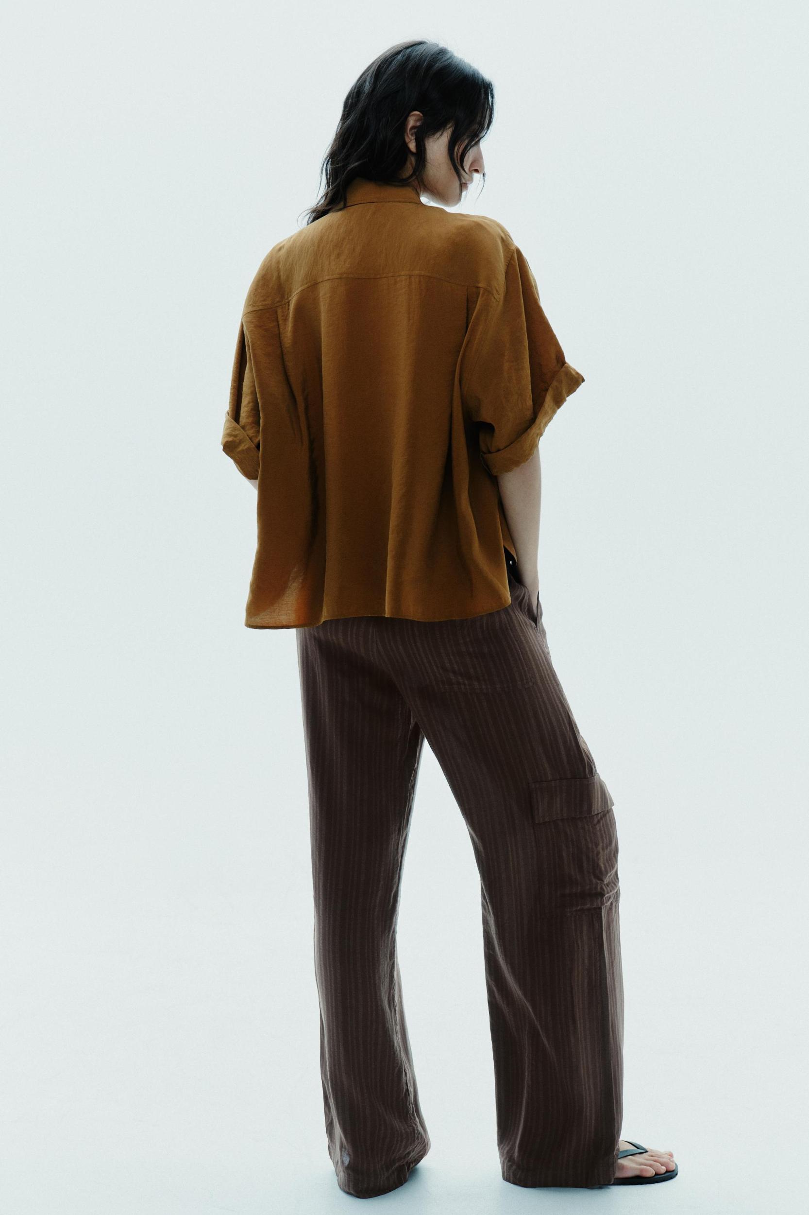 FLOWY SHORT SLEEVE SHIRT Product Image