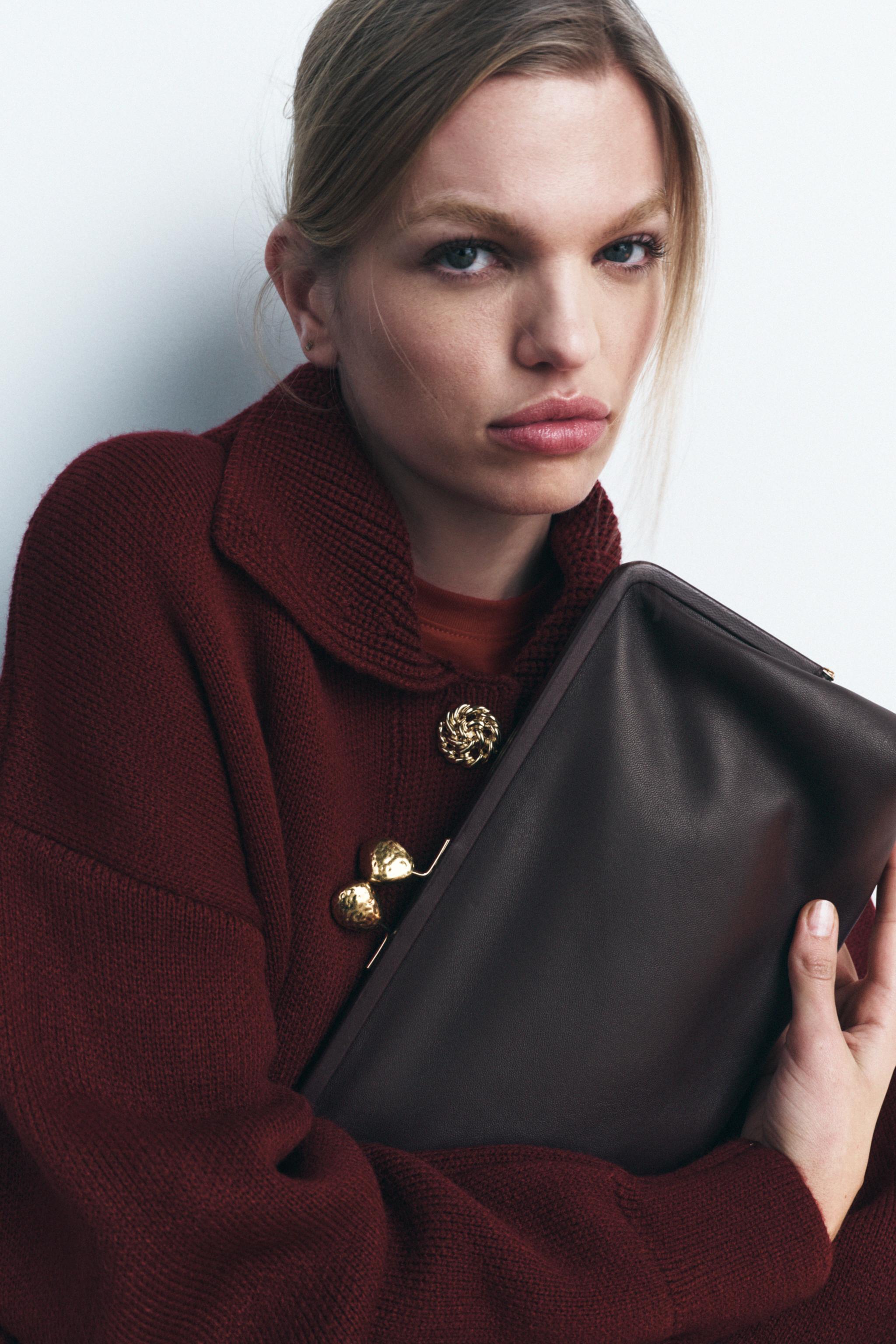 METAL TRIM LEATHER CLUTCH Product Image