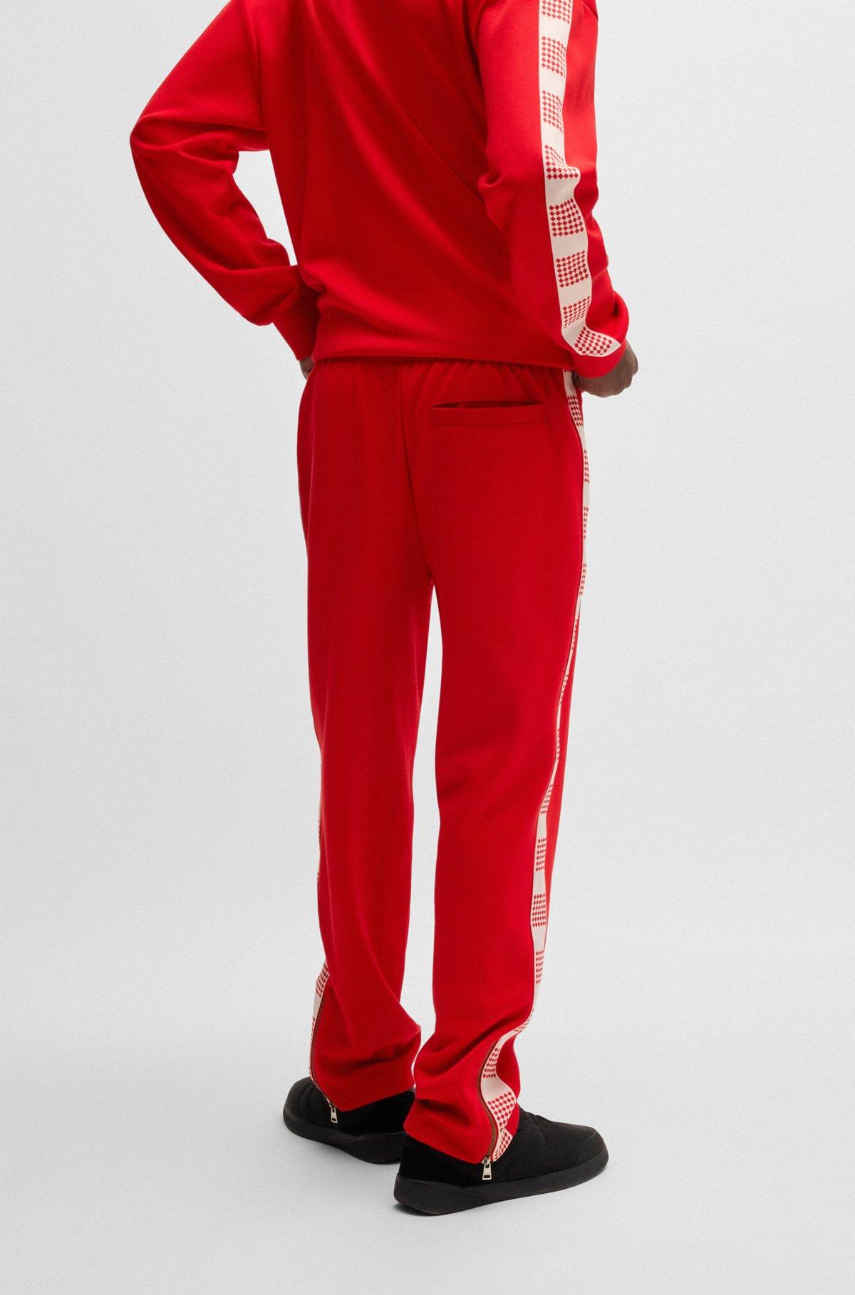 HUGO - Tracksuit bottoms with checked tape - light pink Product Image
