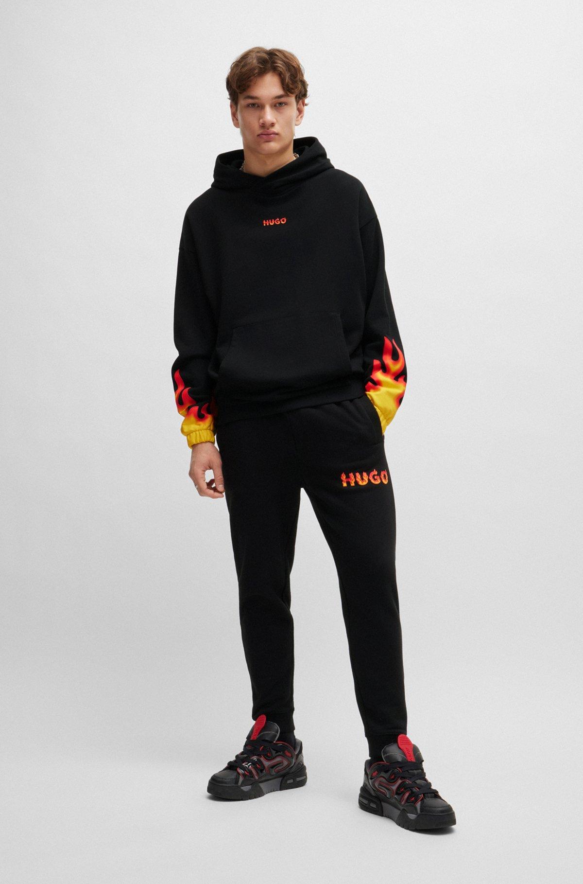 Cotton-terry tracksuit bottoms with puffed flame logo Product Image