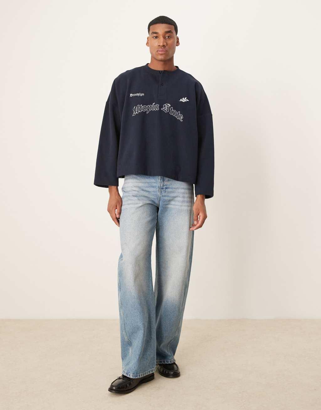 ASOS DESIGN super oversized cropped lightweight sweater with henley neck and print in navy Product Image