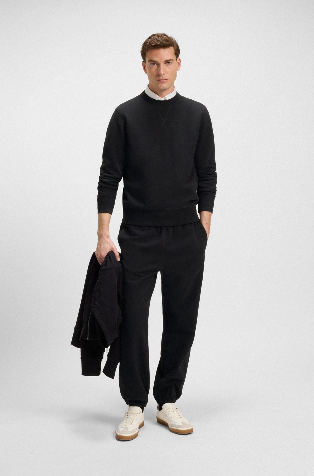 BOSS - BECKHAM x BOSS relaxed tracksuit bottoms in cotton terry - Black Product Image