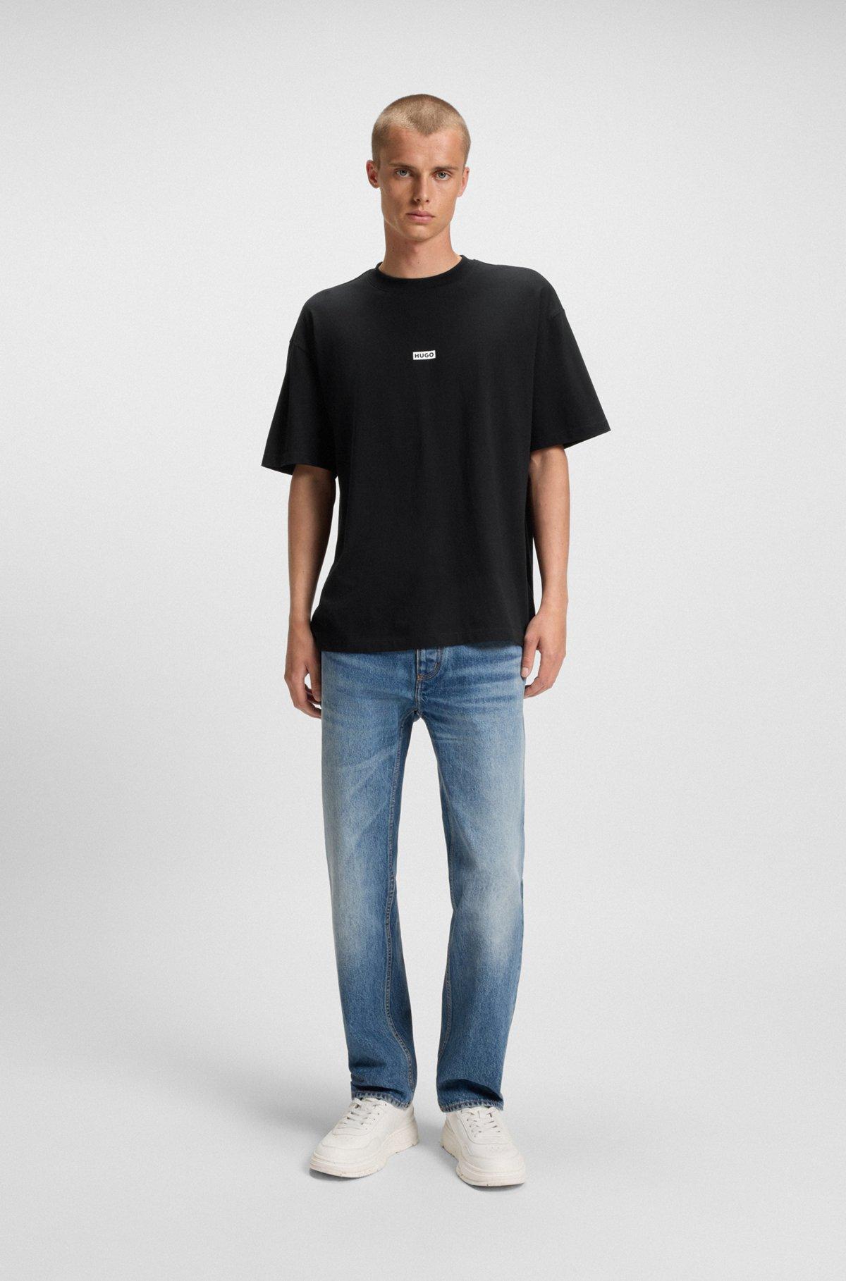 HUGO - Loose-fit T-shirt in cotton with rear logo artwork - Black Product Image