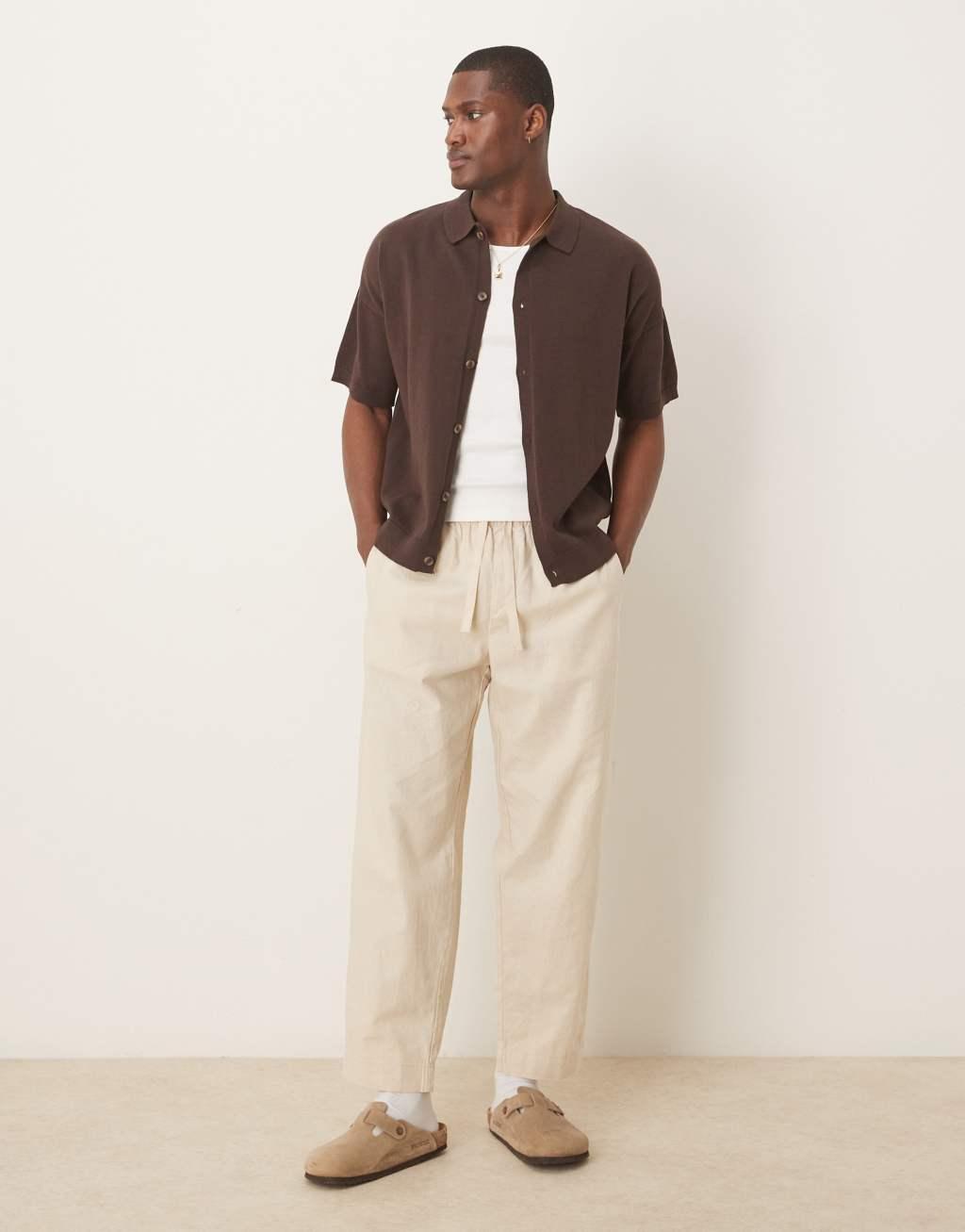 ASOS DESIGN relaxed lightweight knitted cotton button through polo in brown Product Image