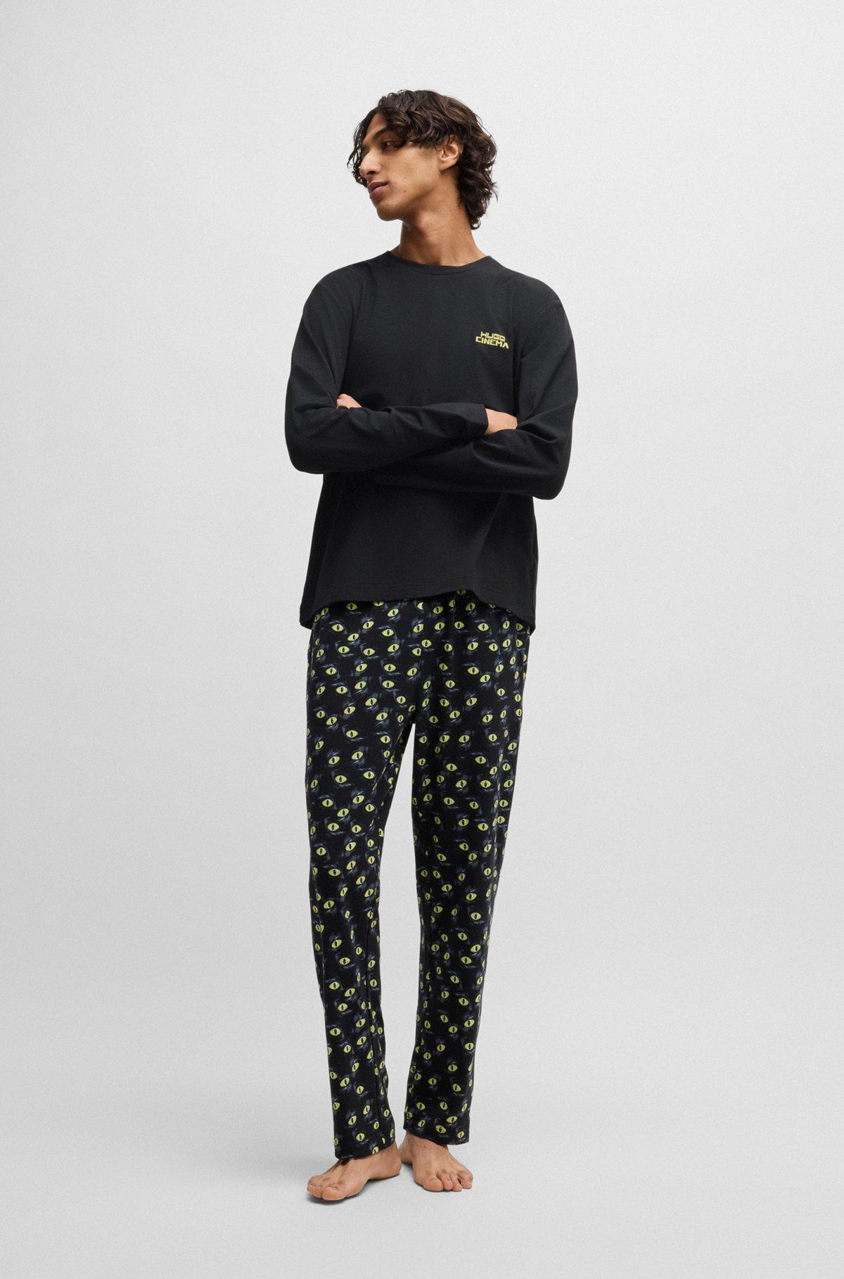 Stretch-cotton pajamas with 70s film graphics Product Image