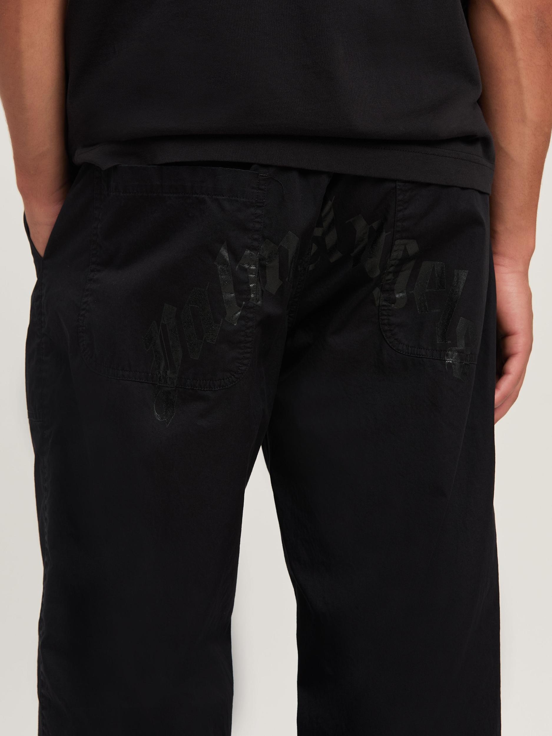 CURVED LOGO LOOSE PANTS Product Image