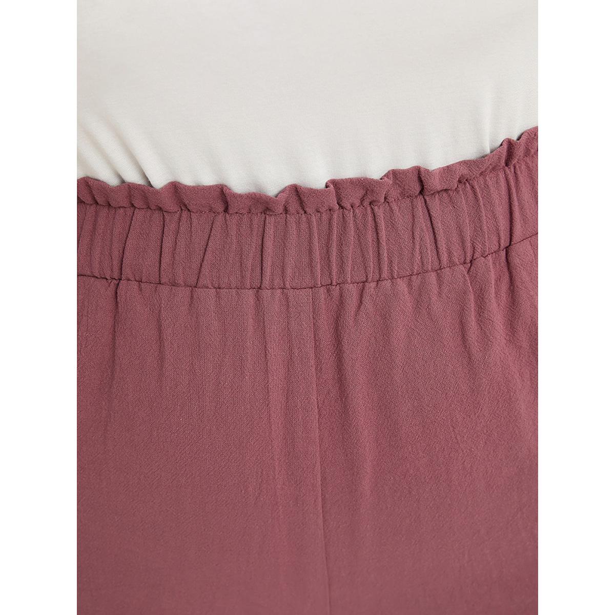 Plus Size Plain Paperbag Waist Asymmetrical Hem Pocket Button Detail Pants Women Mauve Casual Loose High Rise Office Pants BloomChic 28/5X Product Image