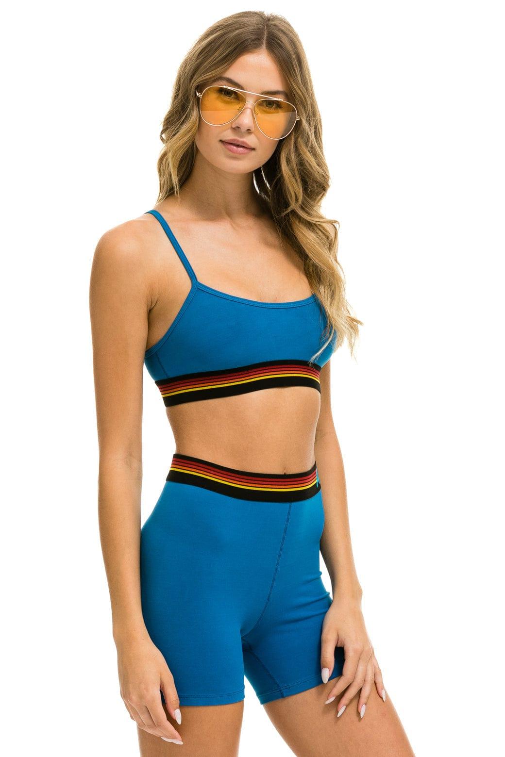 LOGO 4 INCH HI-RISE BIKER SHORT - CARIBBEAN Female Product Image