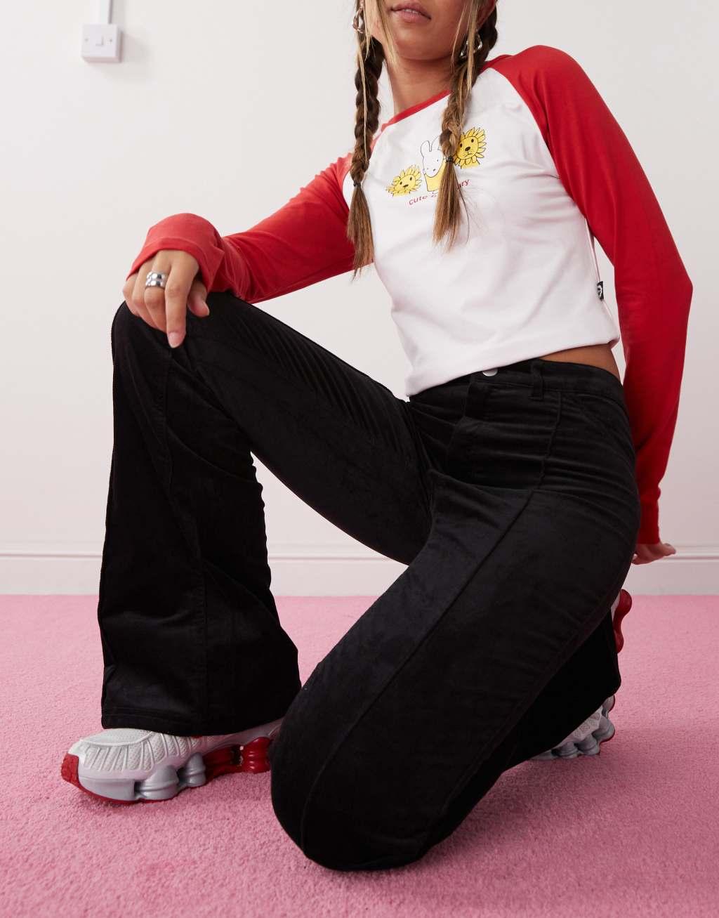 Monki cord flare leg pants with front pintuck seam in black Product Image