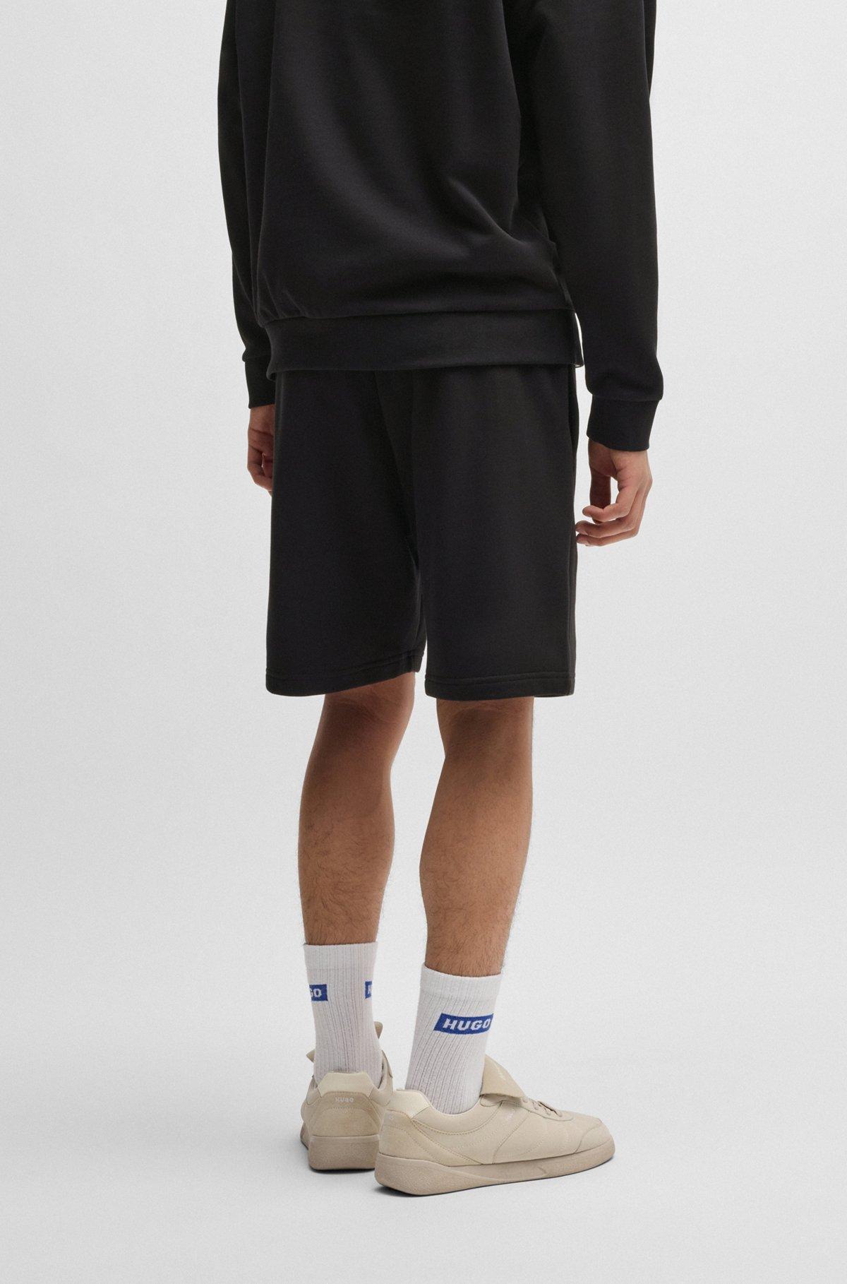 Cotton-terry shorts with Happy HUGO logo Product Image