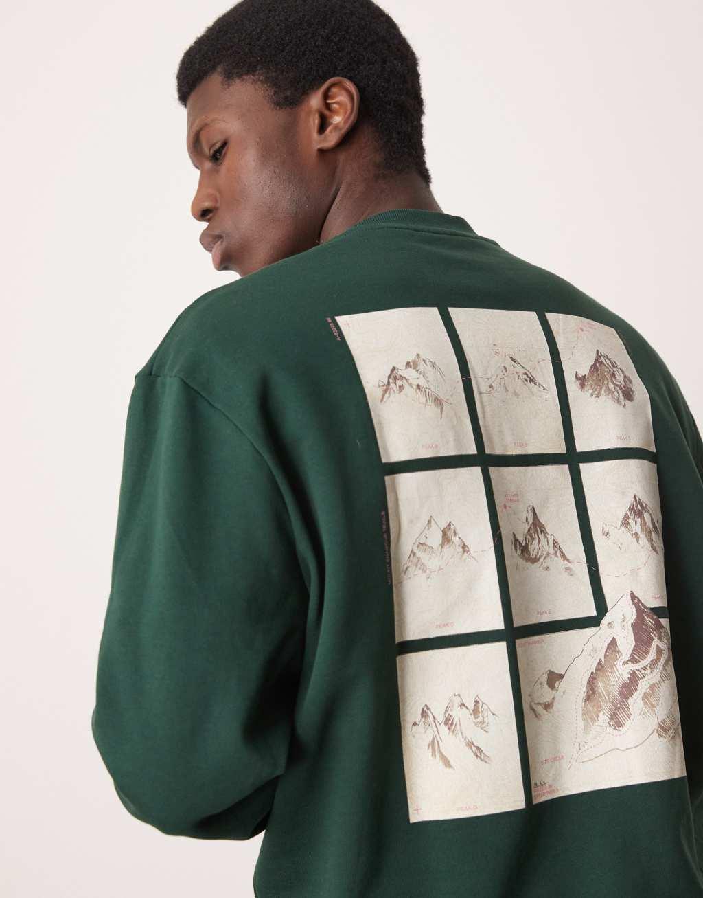 ASOS DESIGN oversized sweatshirt with chest embroidery and mountain back print in dark green Product Image
