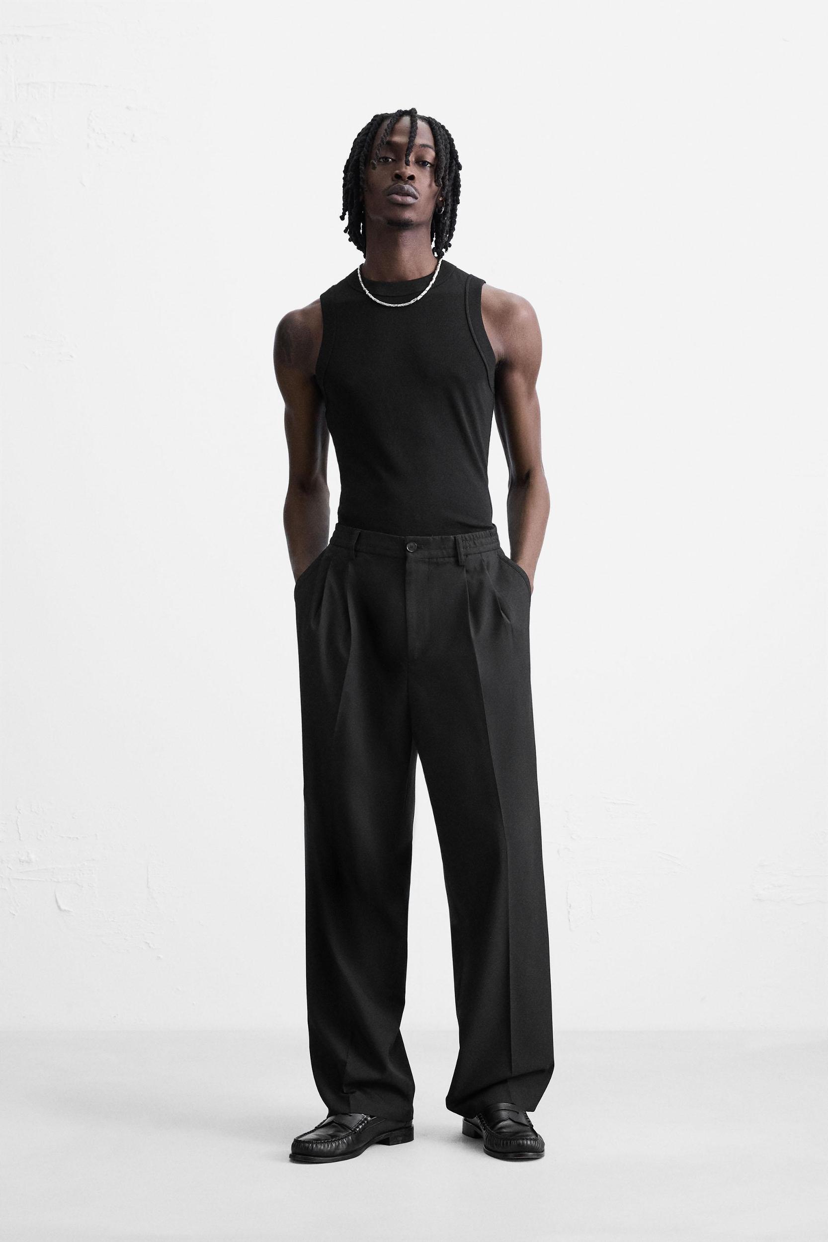 FLOWY PLEATED WIDE FIT PANTS Product Image