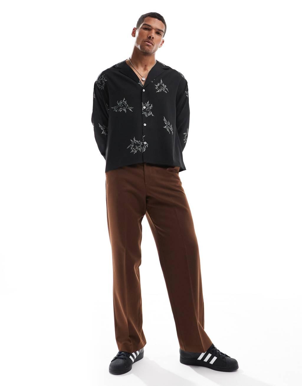 ASOS DESIGN boxy oversized deep revere shirt with heart print in black Product Image