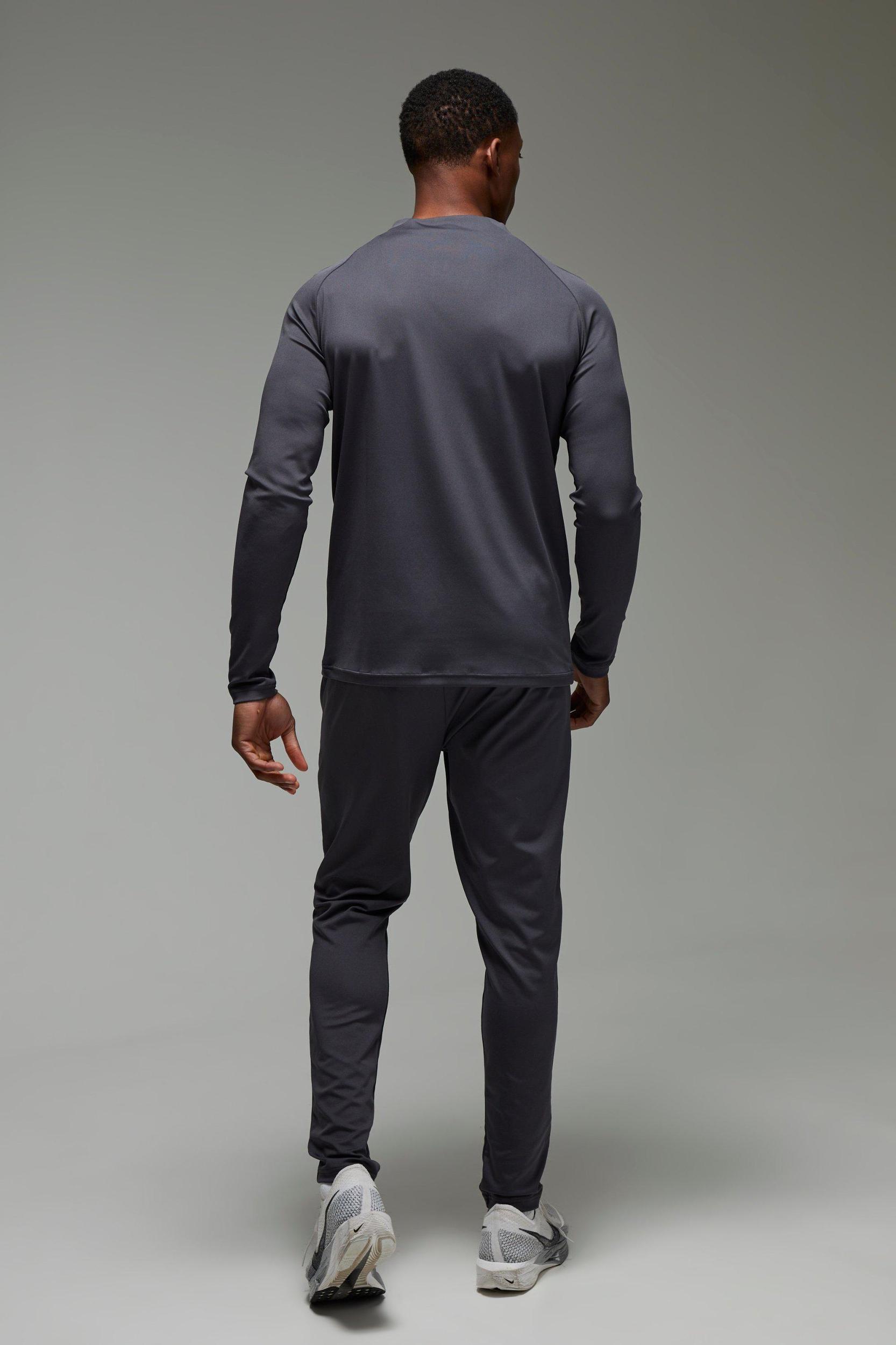 Man Active Muscle Fit Crew Neck 1/4 Zip Tracksuit | boohooMAN USA Product Image